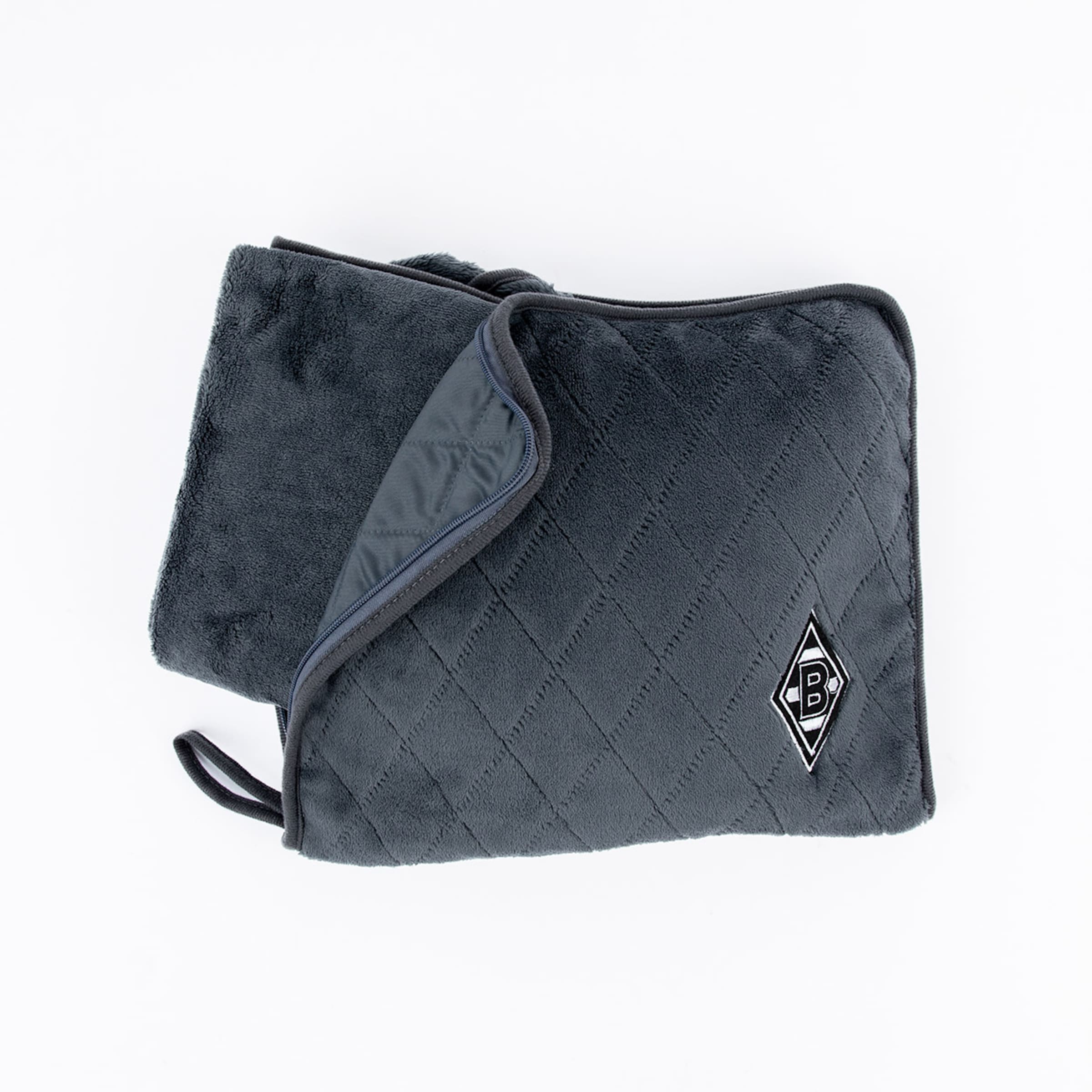 Dunkelgraues, gestepptes Plüschkissen mit Borussia Mönchengladbach Logo, teilweise geöffnet mit Reißverschluss.