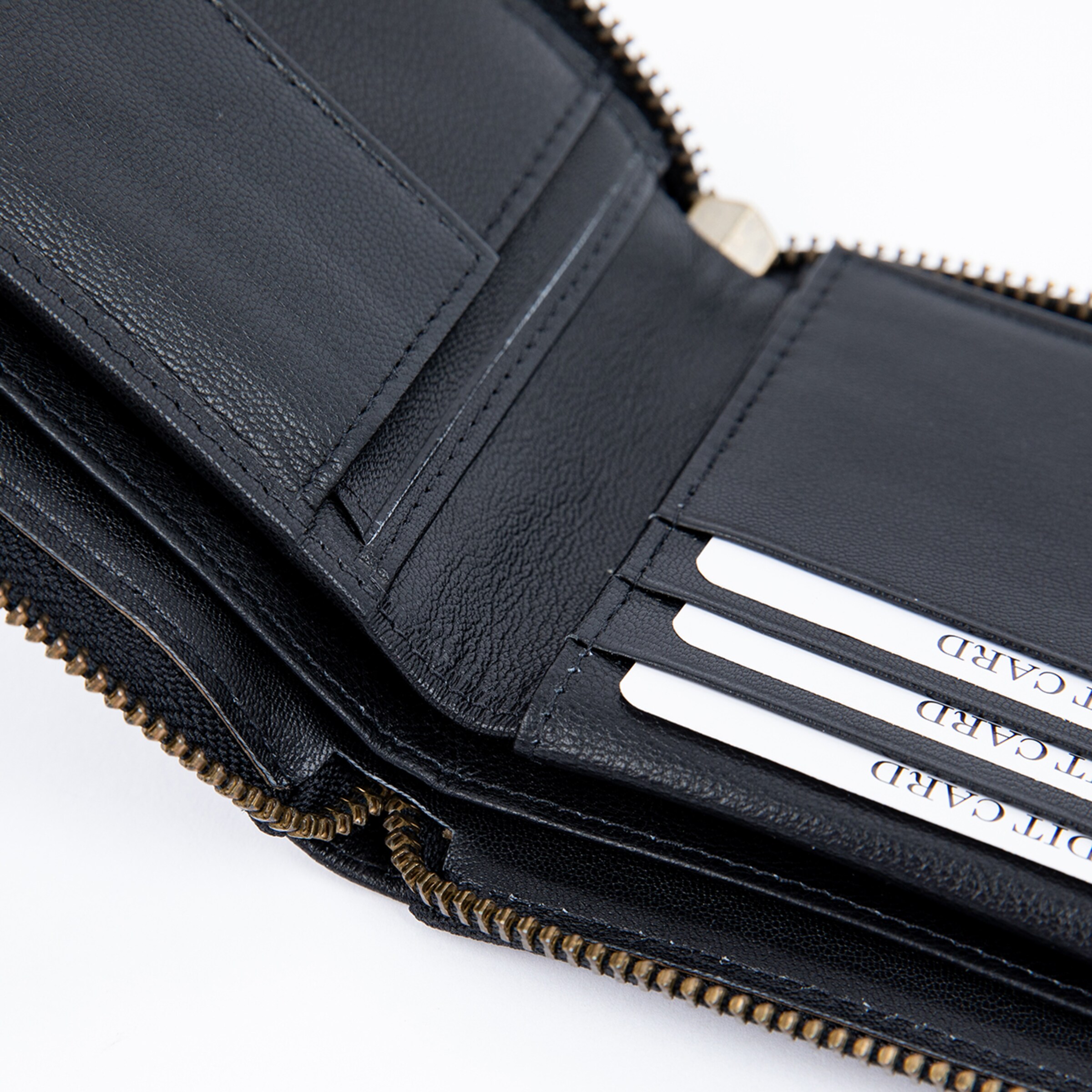 Black leather wallet with multiple card slots and zipper.