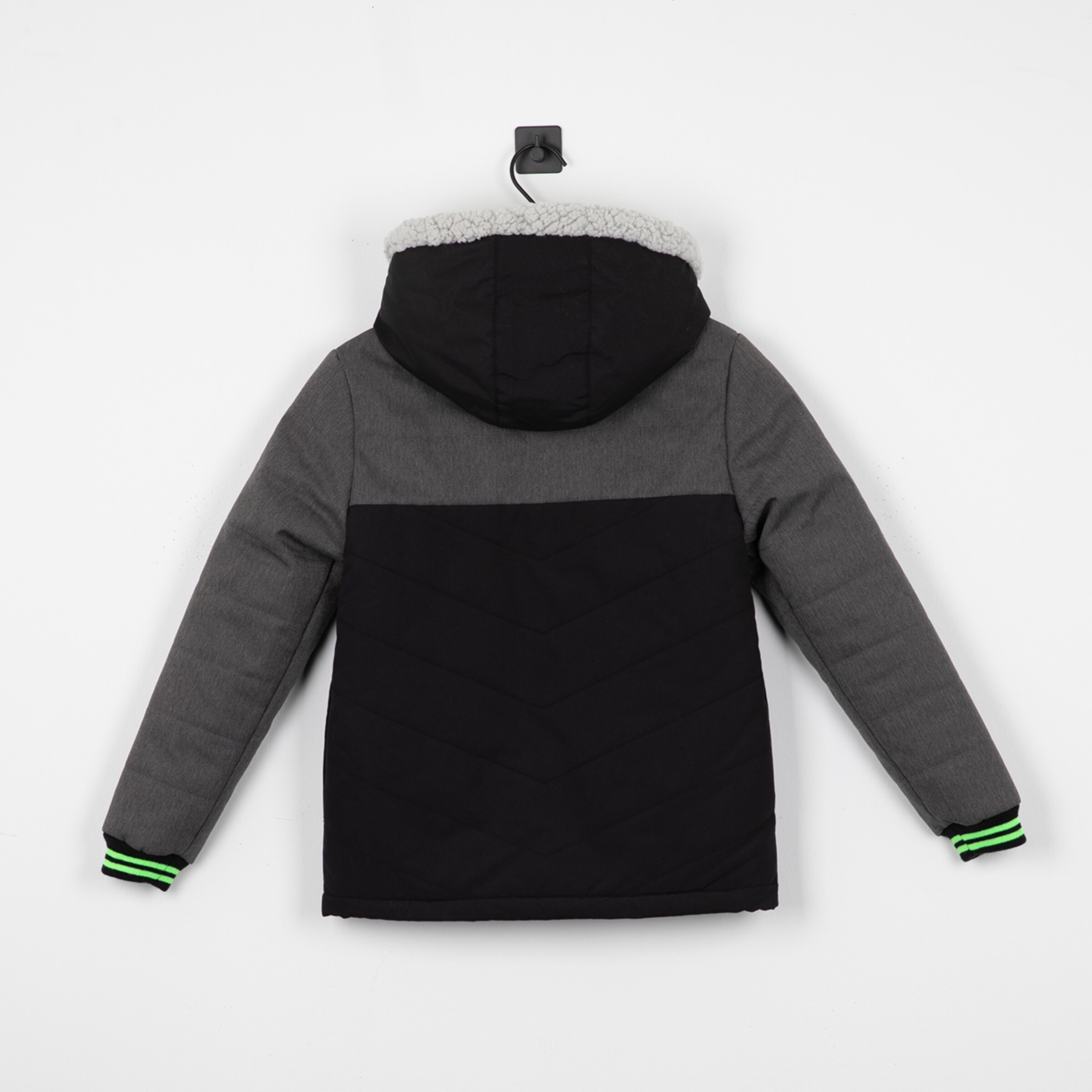 Black and grey jacket with hood and faux fur collar photographed from the back.