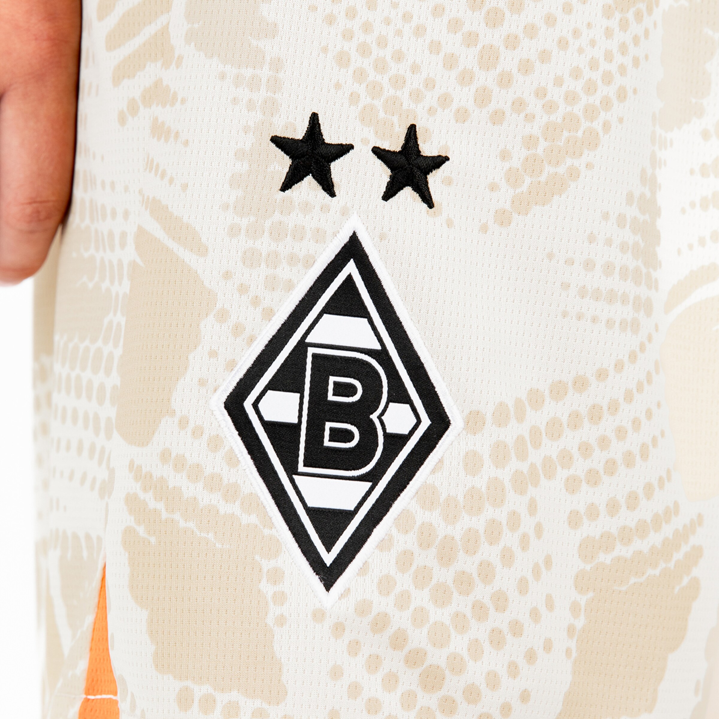 Two stars above the Borussia Mönchengladbach logo on a jersey.