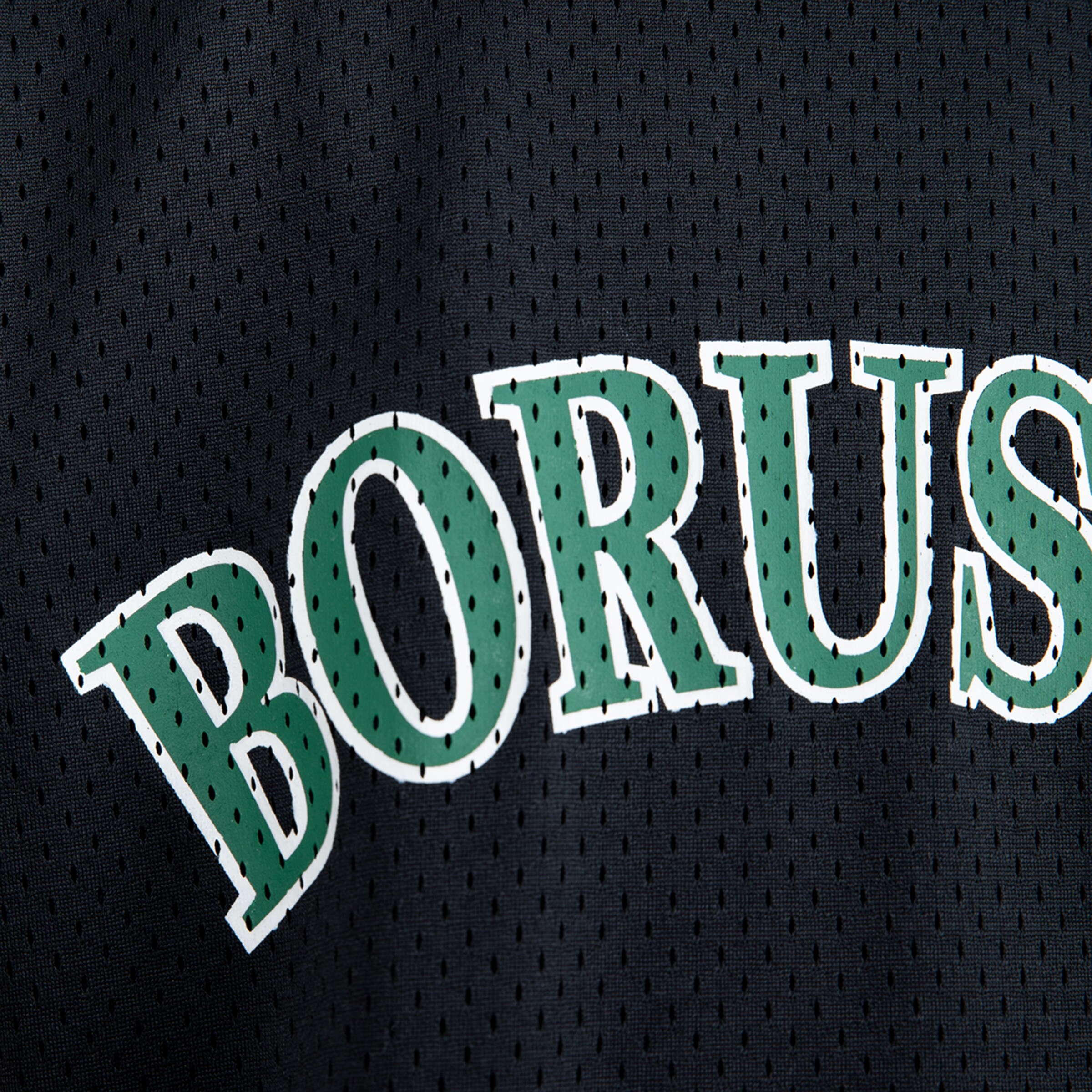 Close-up of a jersey featuring the word BORUSIA in green.
