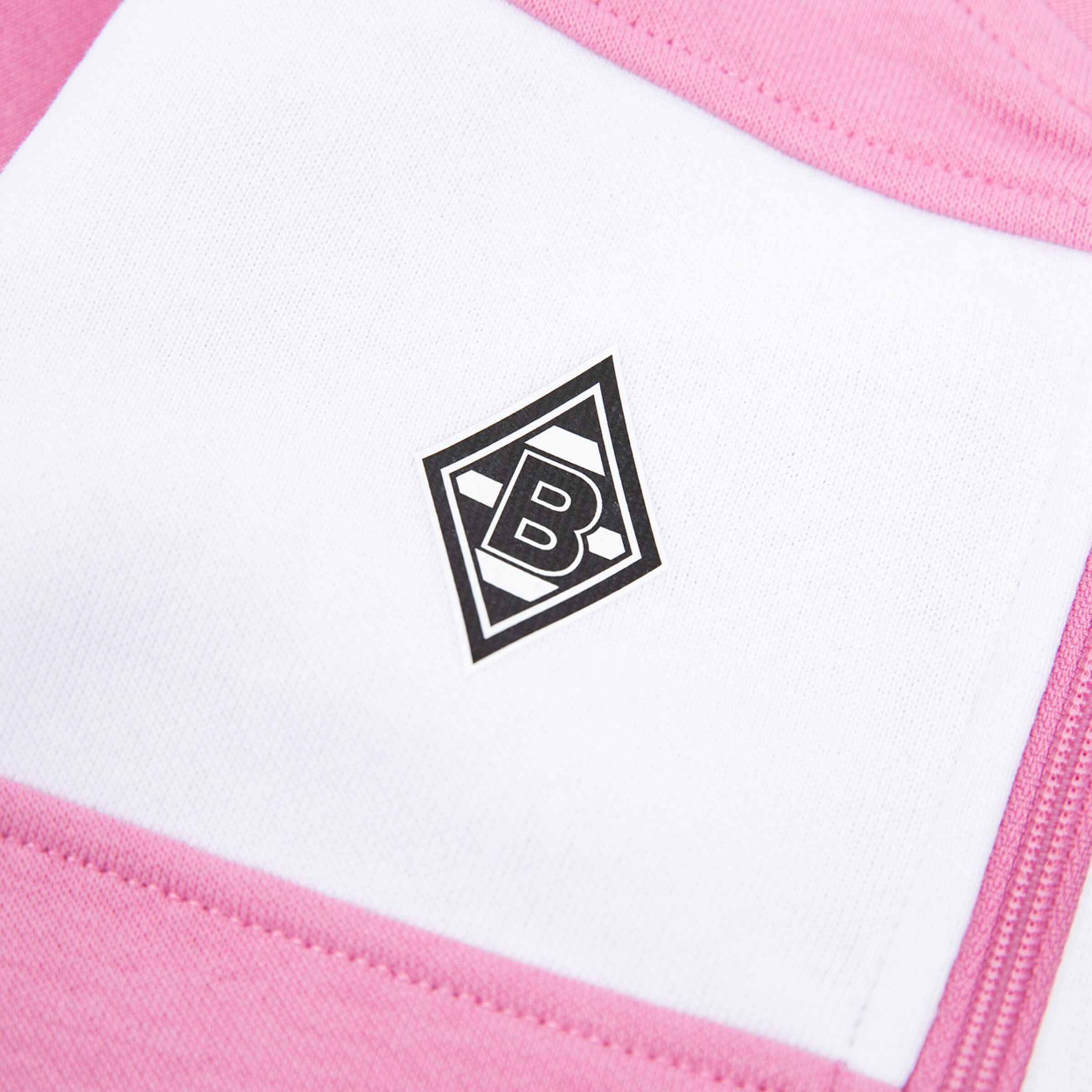 Borussia Mönchengladbach logo on pink and white fabric.