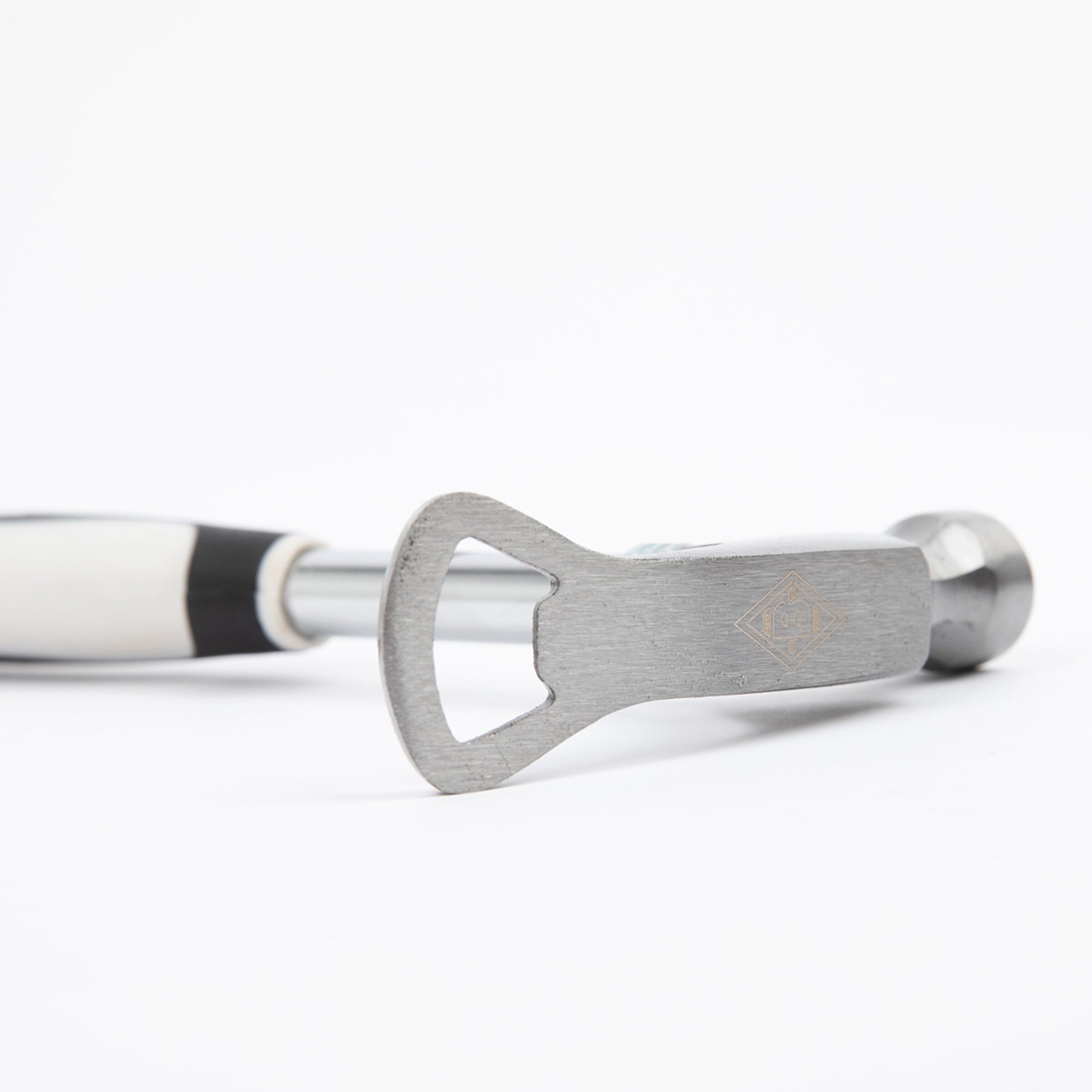 Close-up of a wooden hammer with an aluminum handle featuring an integrated bottle opener.