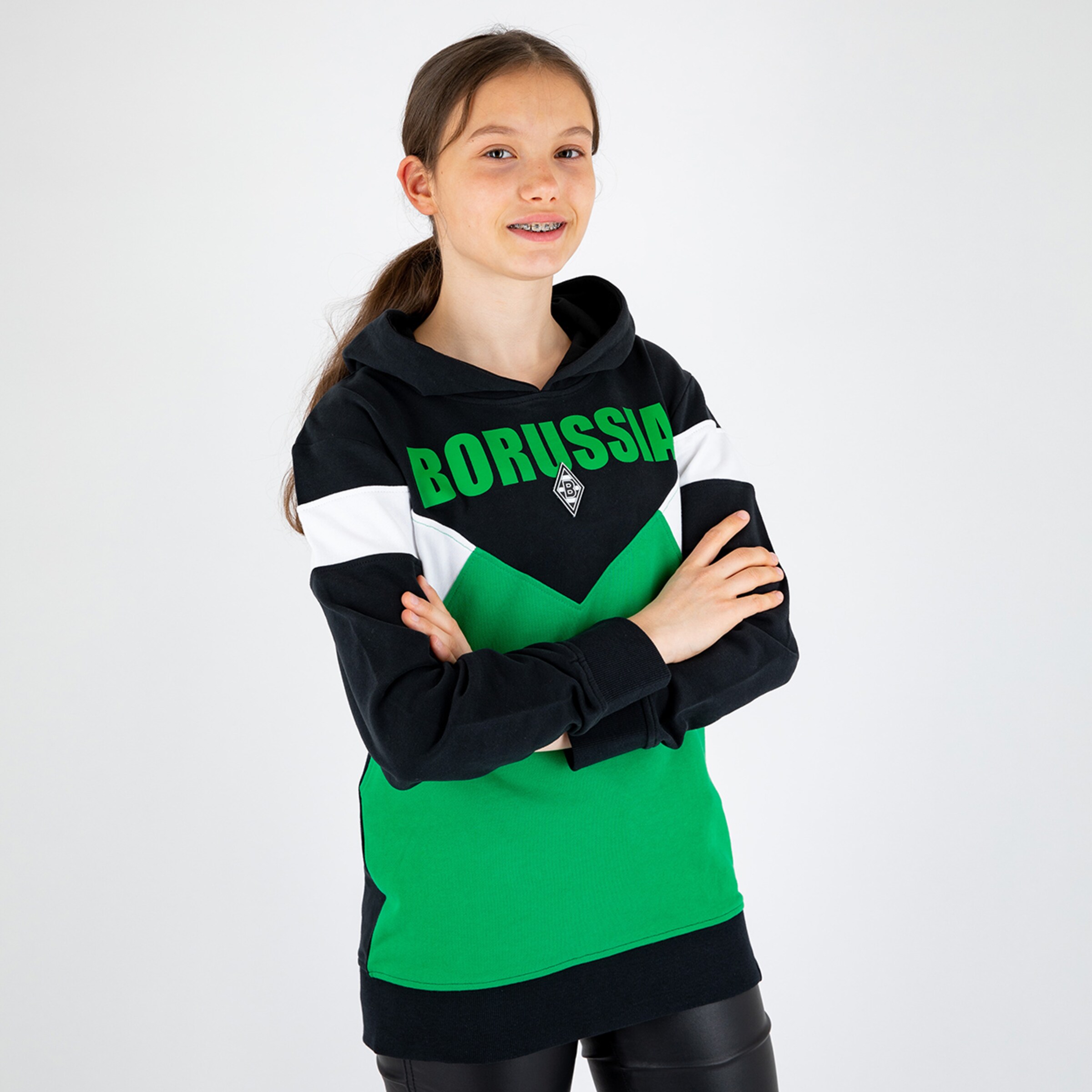 Girl wearing a black and green hoodie with BORUSSIA print.
