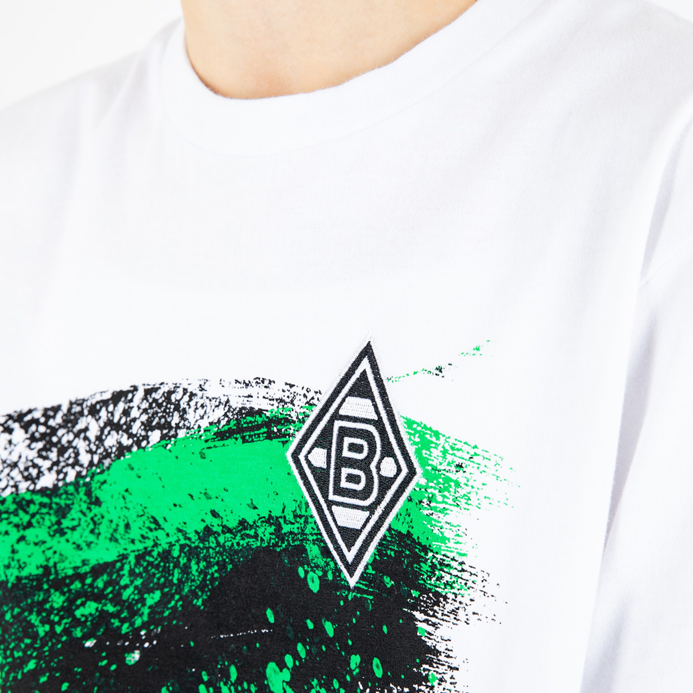 White t-shirt featuring black and green graphics with Borussia Mönchengladbach logo.