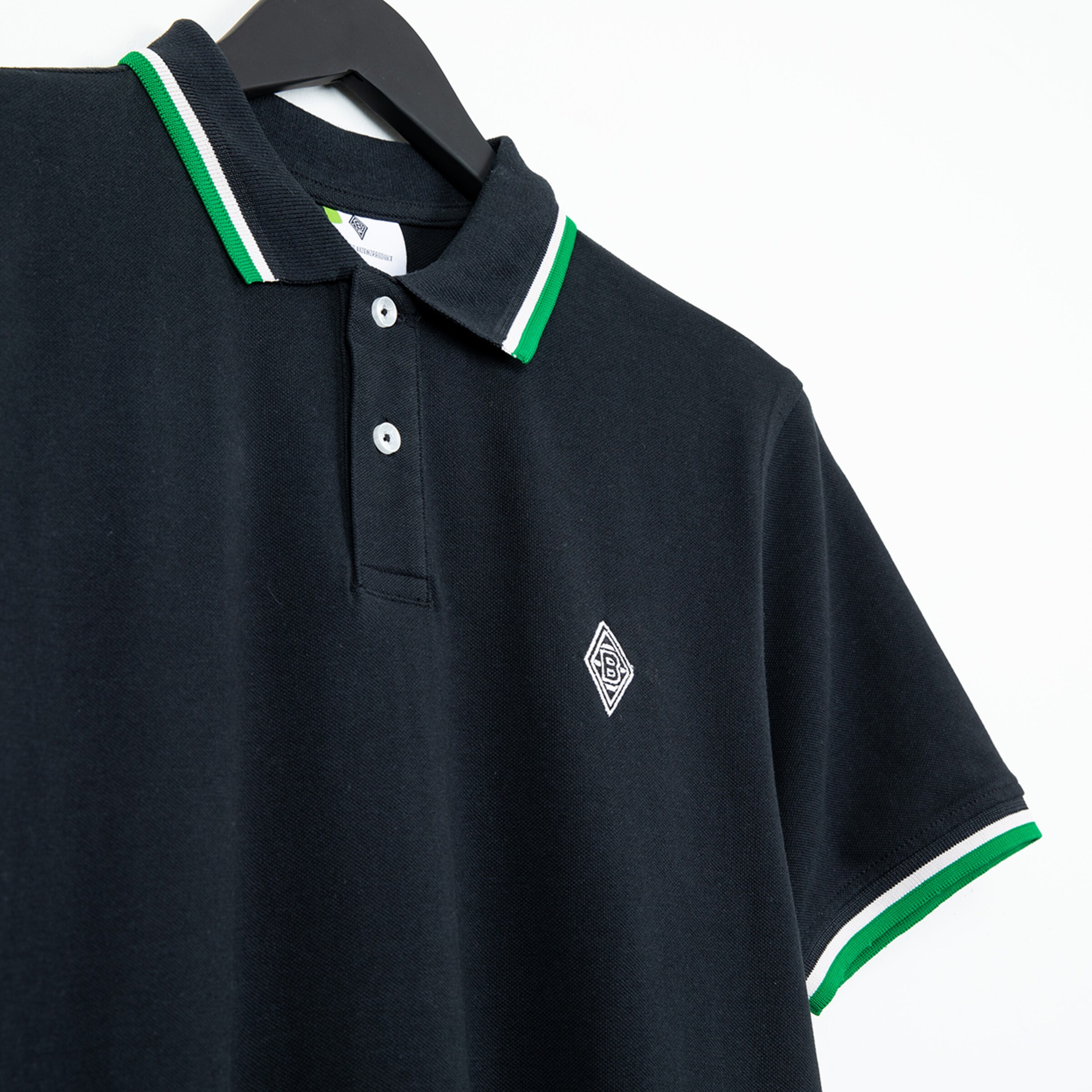 Black polo shirt with green and white trim and Borussia Mönchengladbach logo.
