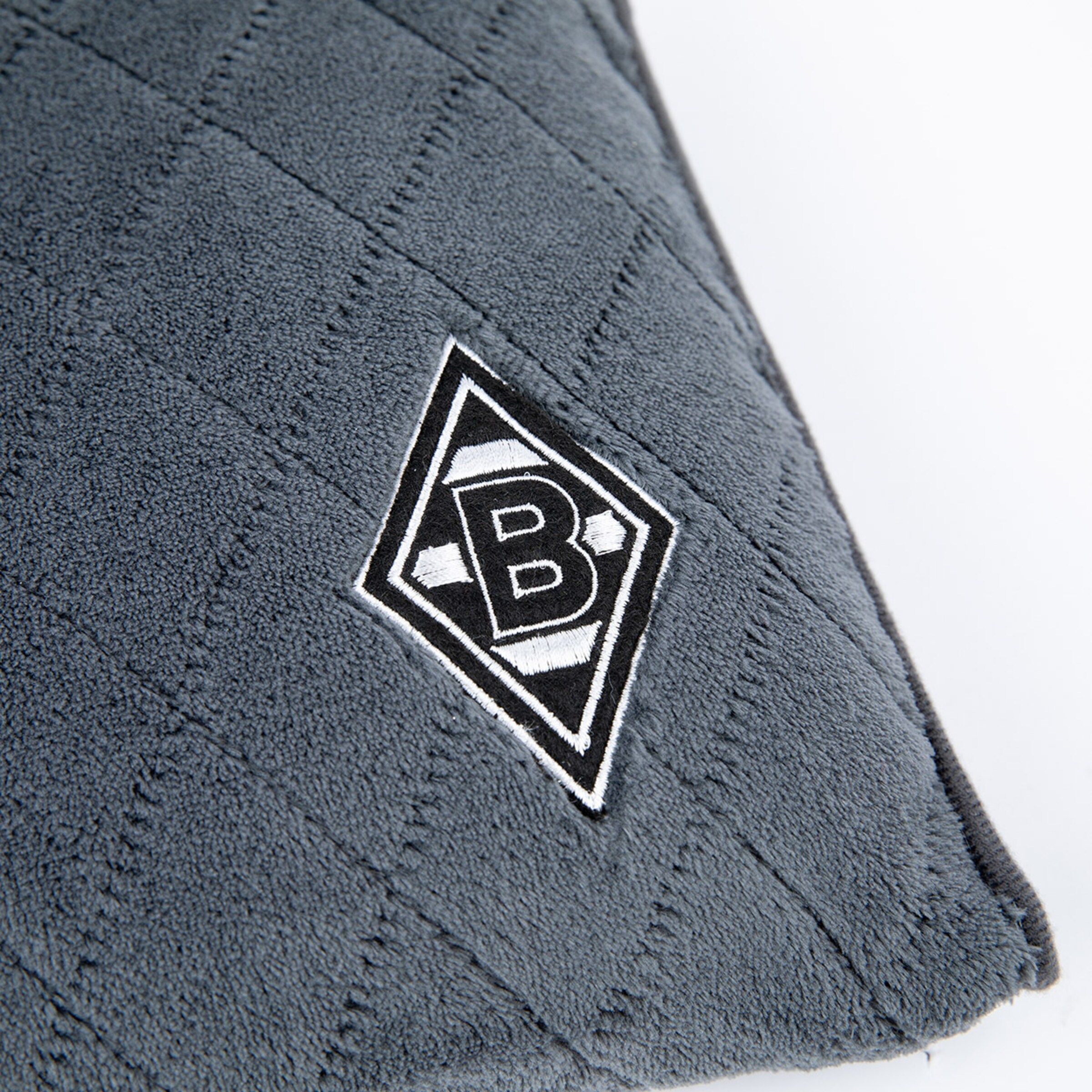 Grau gestepptes Fußball-Dekostück mit Borussia Mönchengladbach-Logo.