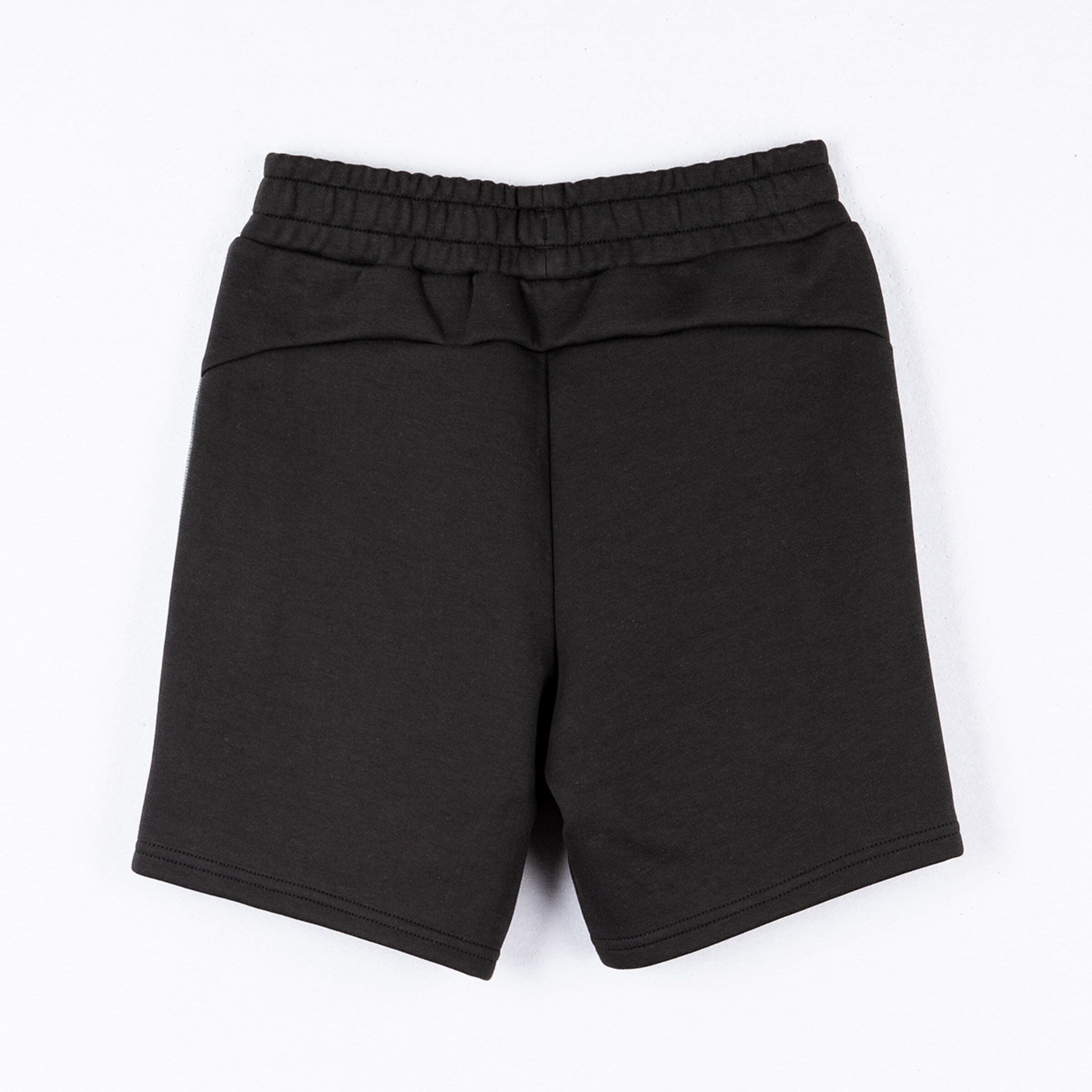 Black shorts with elastic waistband made of soft material back view.