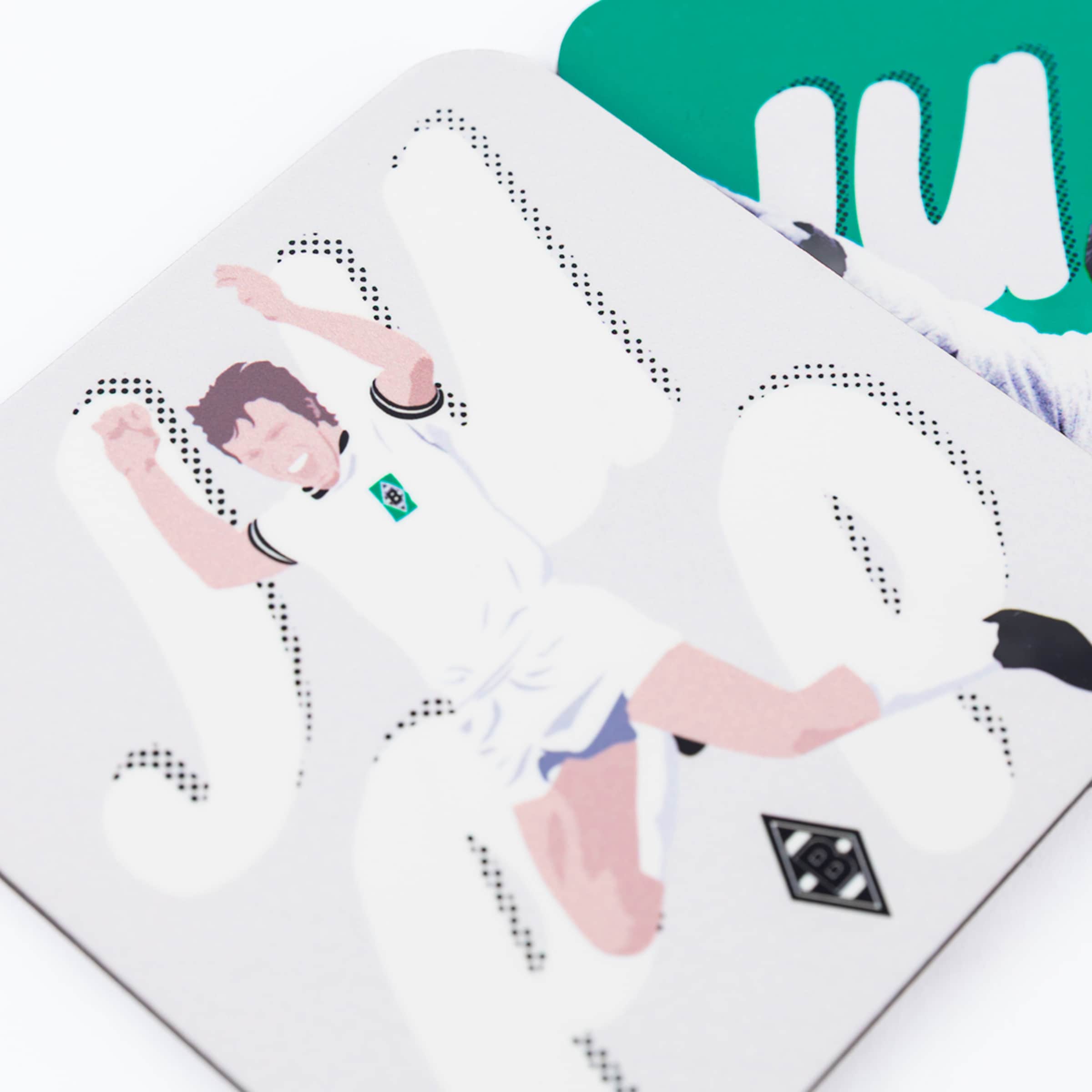 Square coaster featuring a minimalist illustration of a celebrating Gladbach football player in a white kit with club logos.