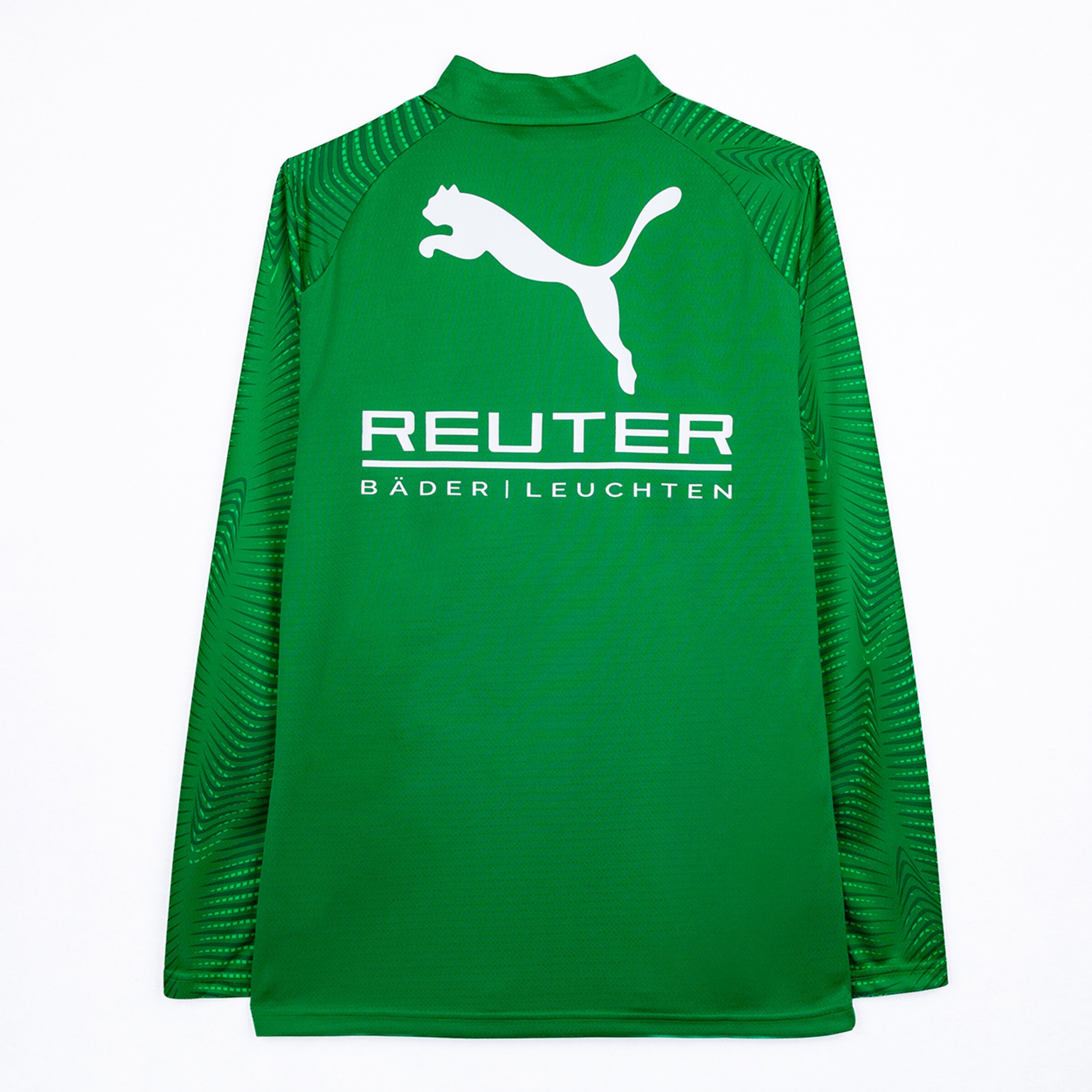 Back view of a green long-sleeved Puma sports jersey featuring the white Puma logo and "REUTER BÄDER | LEUCHTEN" sponsor text. The sleeves have a subtle geometric pattern.
