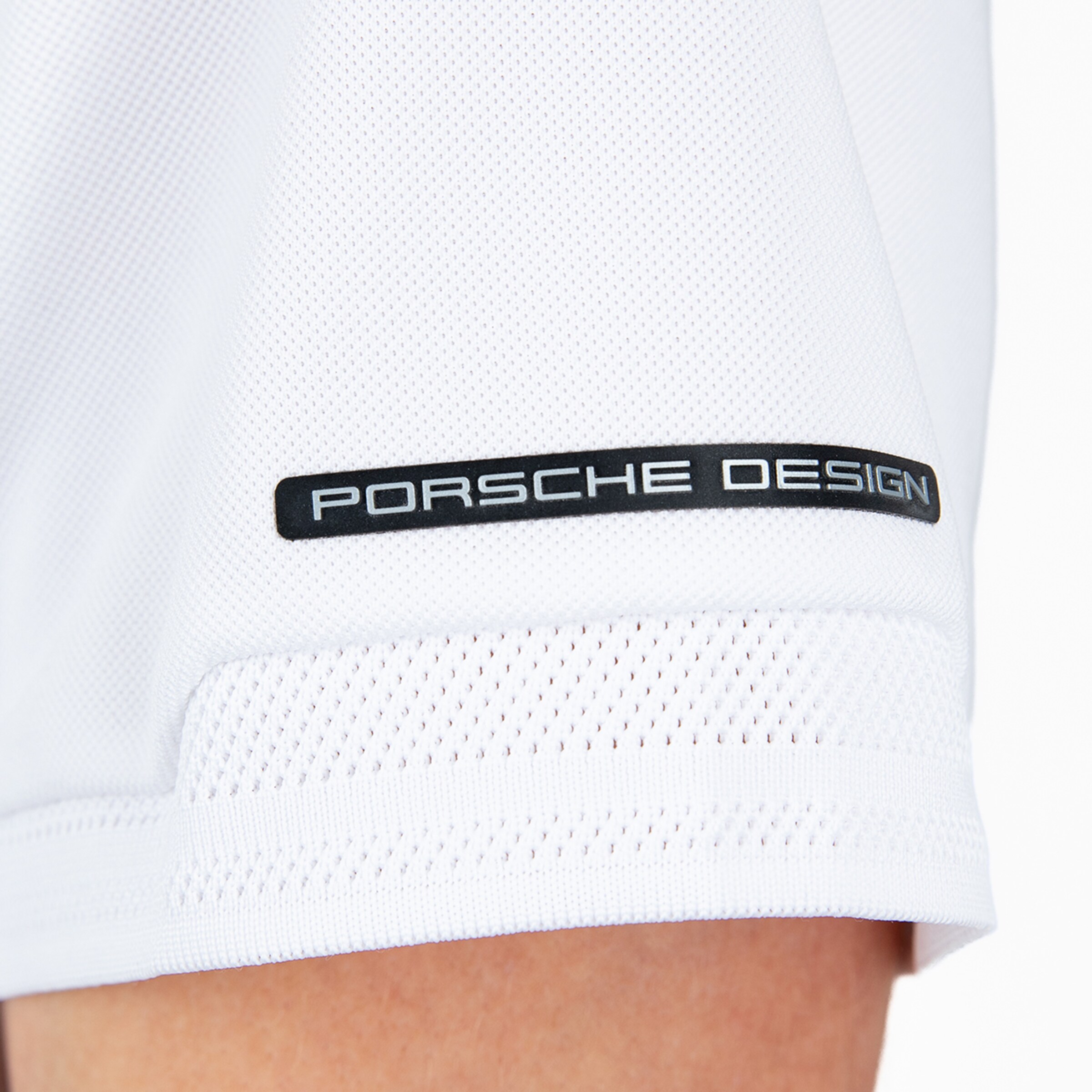 Porsche Design logo on a white jersey.