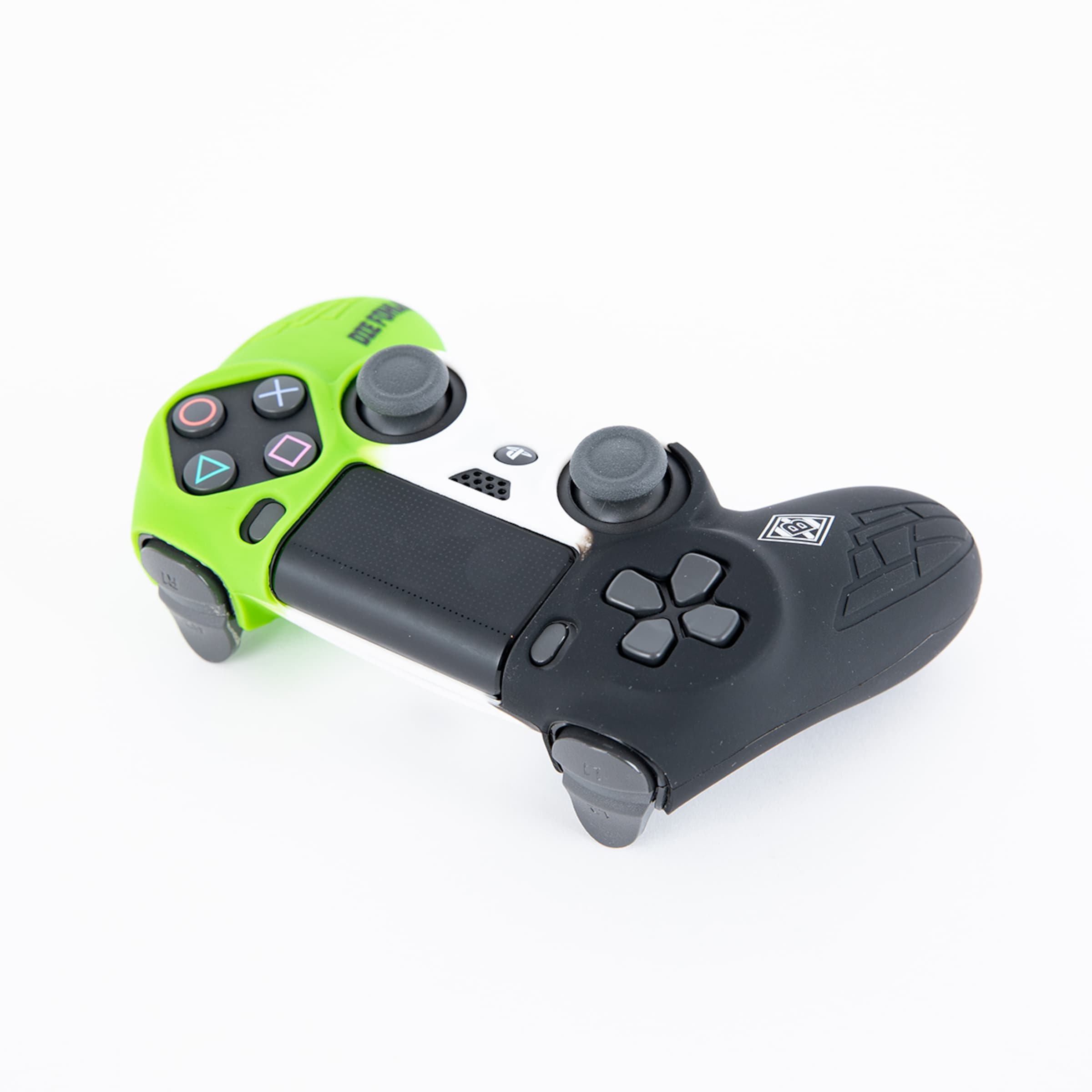 Game controller in green and black with various buttons and joysticks.