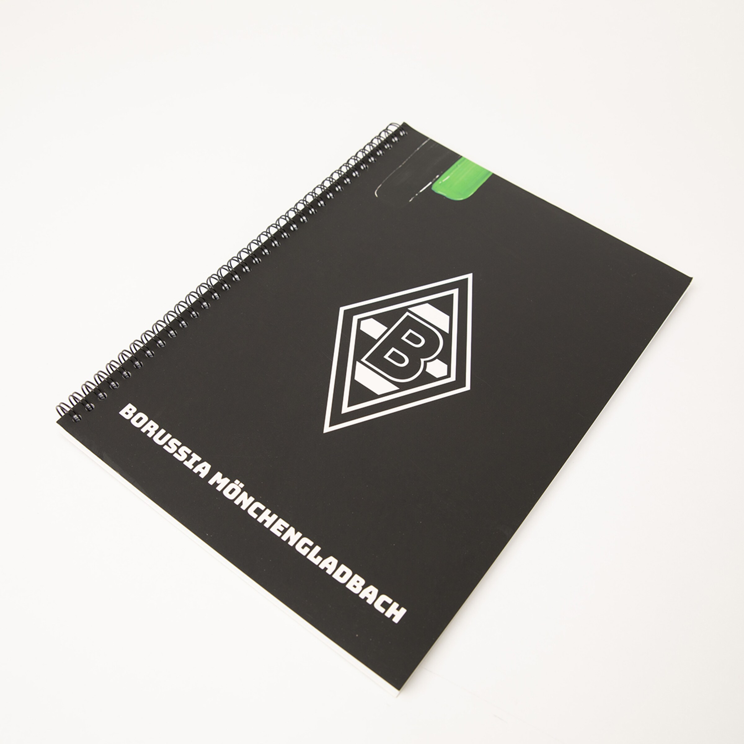 Schwarzes Spiralheft mit dem Logo von Borussia Mönchengladbach.
