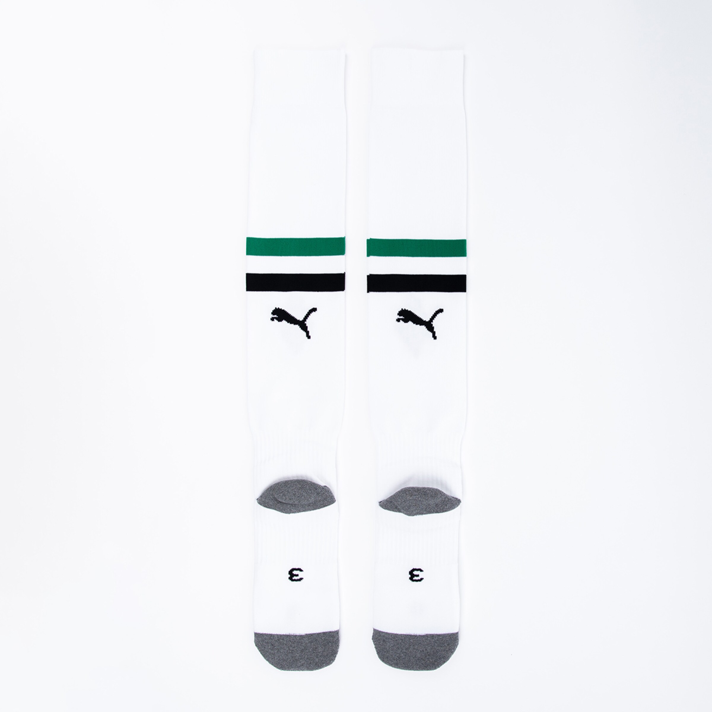 White socks with black and green stripes featuring a Puma logo.
