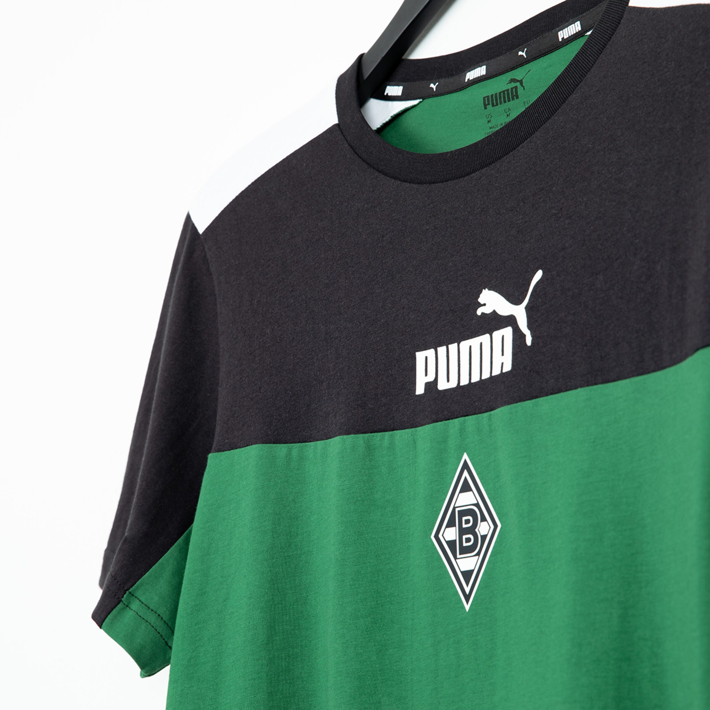 Black and green Puma jersey featuring Borussia Mönchengladbach logo.