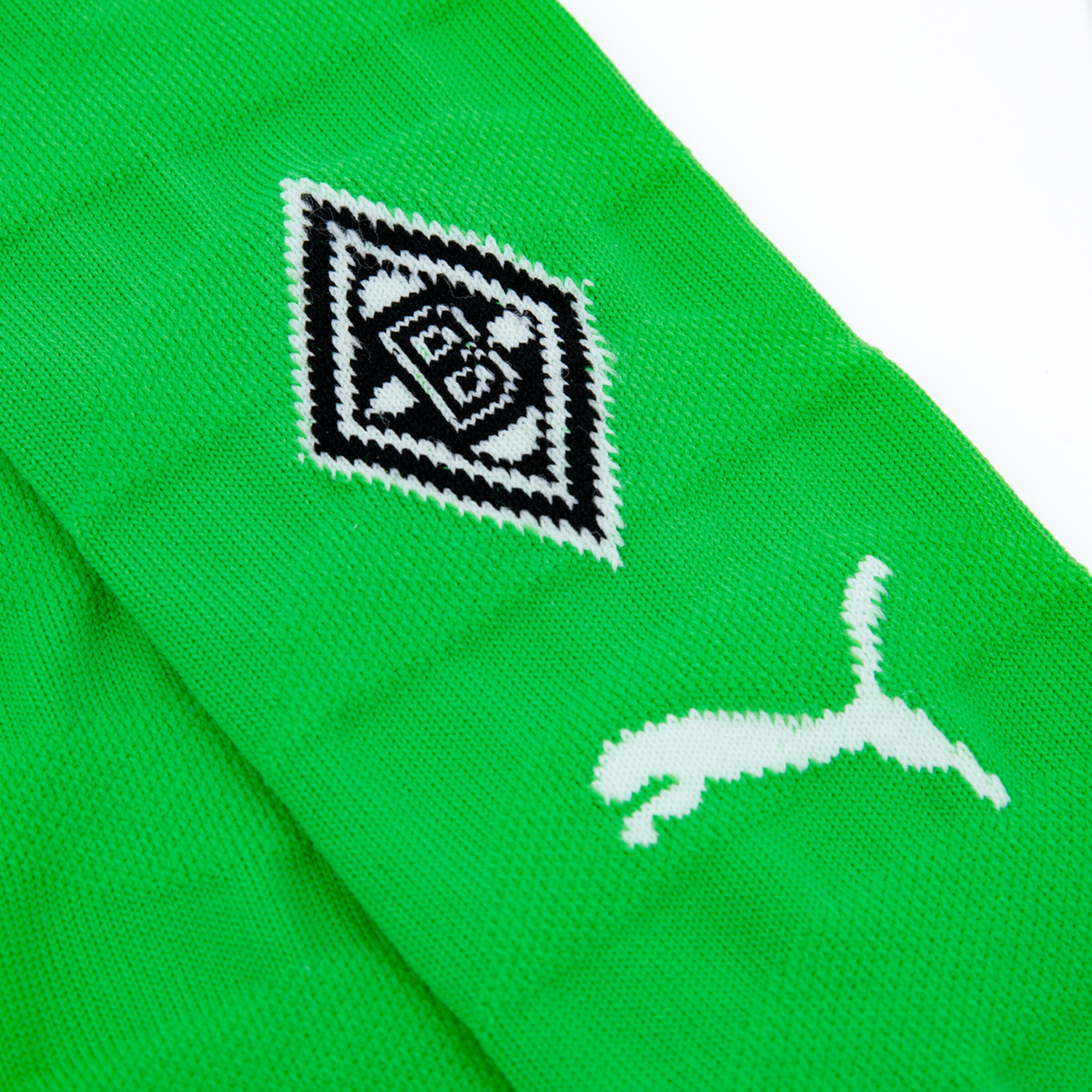 Green sports sock featuring the Borussia Mönchengladbach logo and Puma logo.