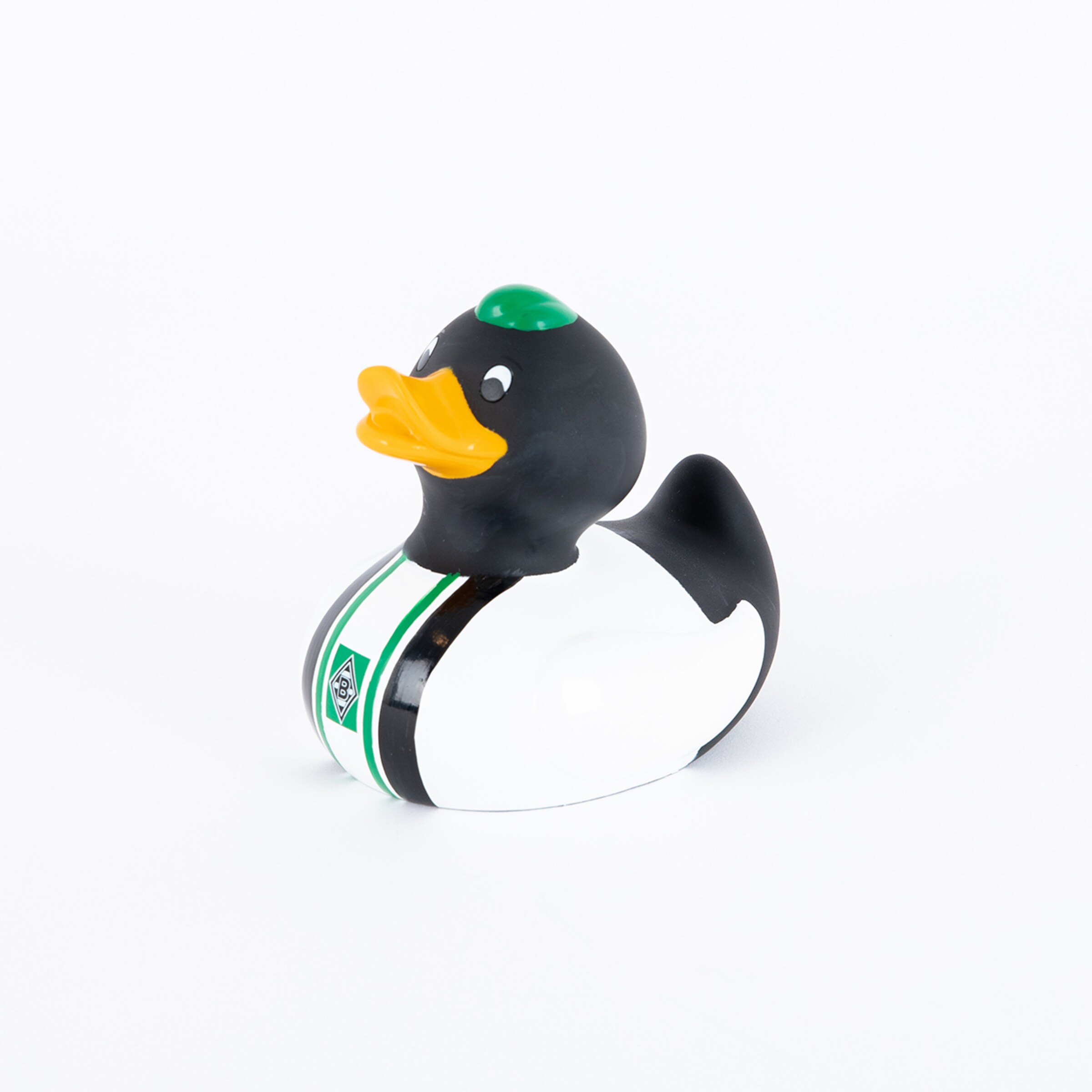 Rubber duck with a black head and white body featuring a green detail.