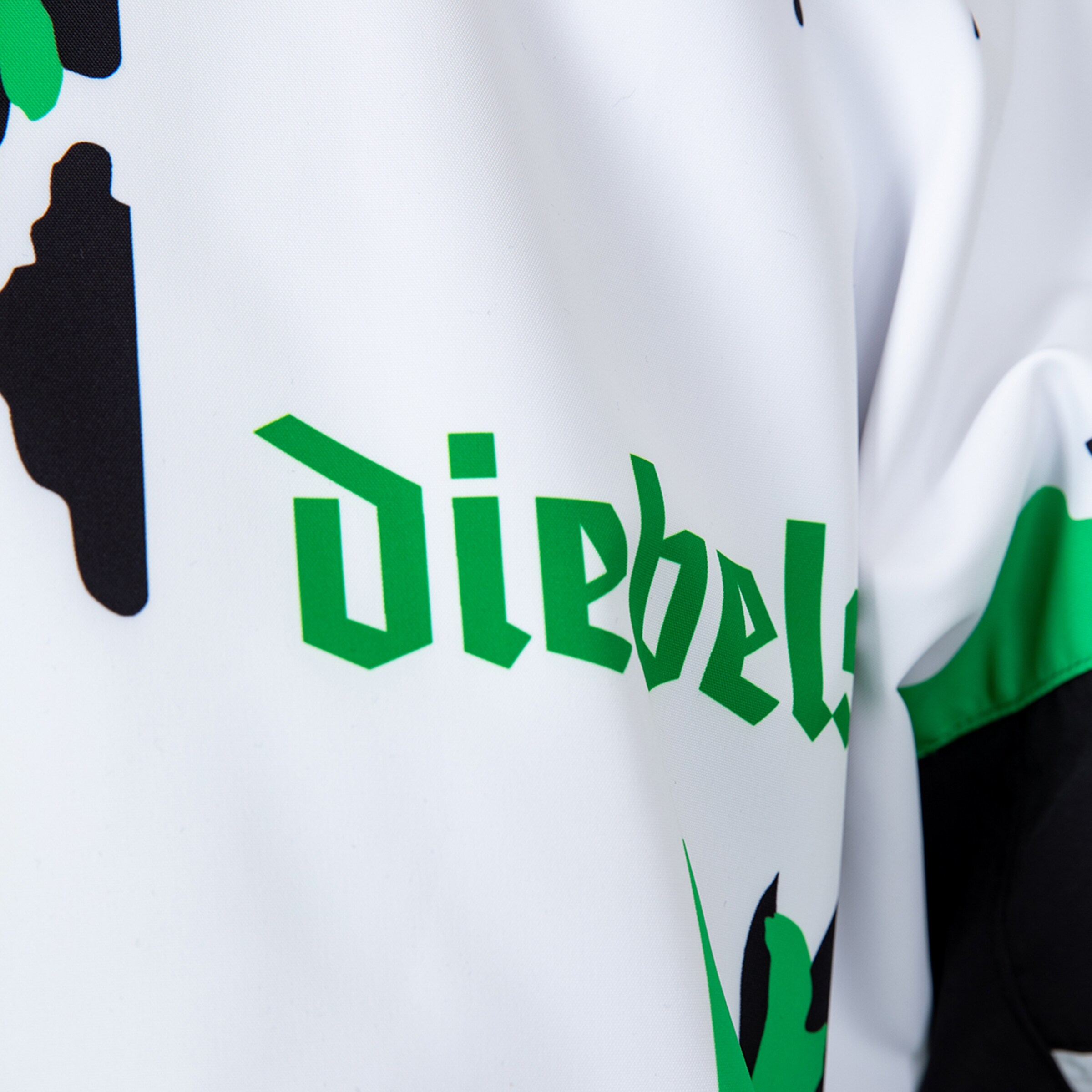 Close-up of a jersey featuring the text Diebels and Borussia Mönchengladbach logo.