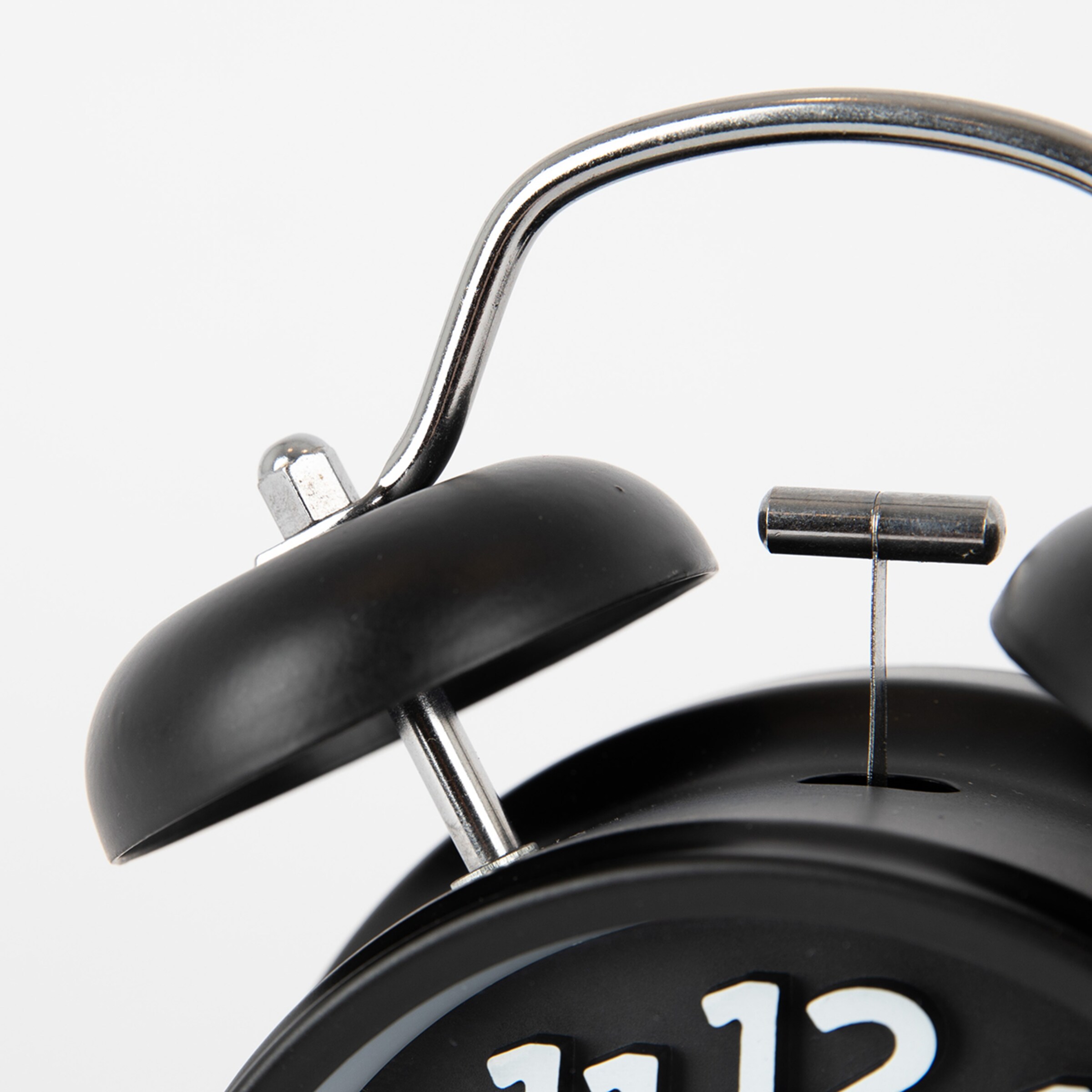 Black and white alarm clock design with two bells and hands pointing to 12 oclock.