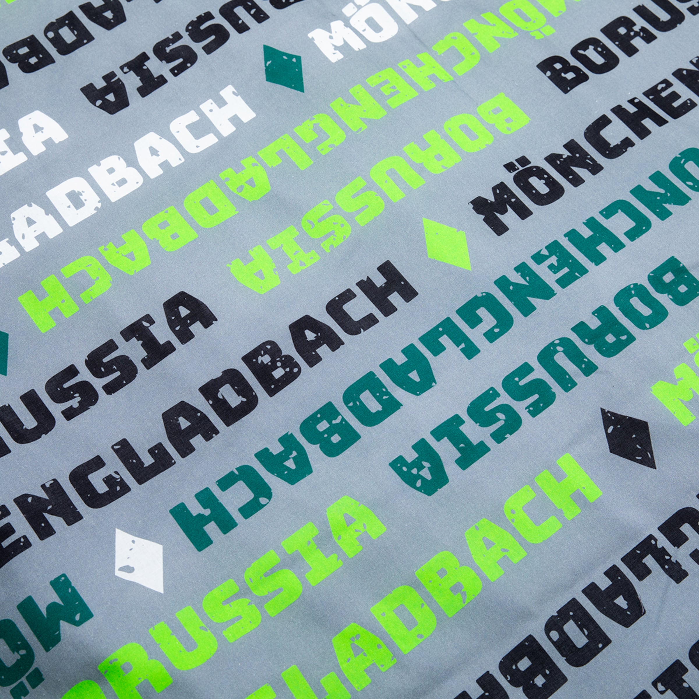 Wiederholte Schriftzüge von Borussia Mönchengladbach in verschiedenen Farben auf grauem Hintergrund.