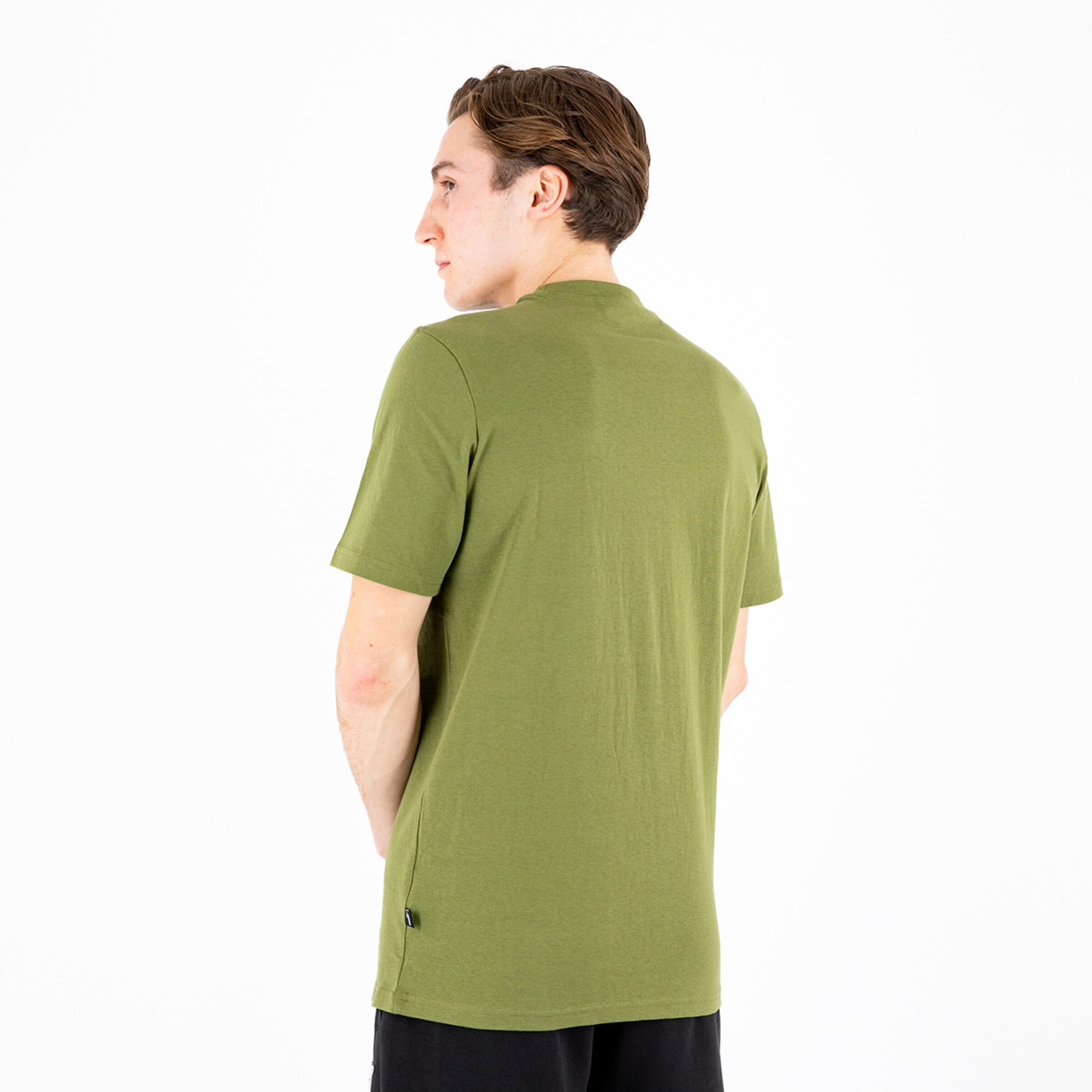 Man in olive green short-sleeve shirt viewed from behind.