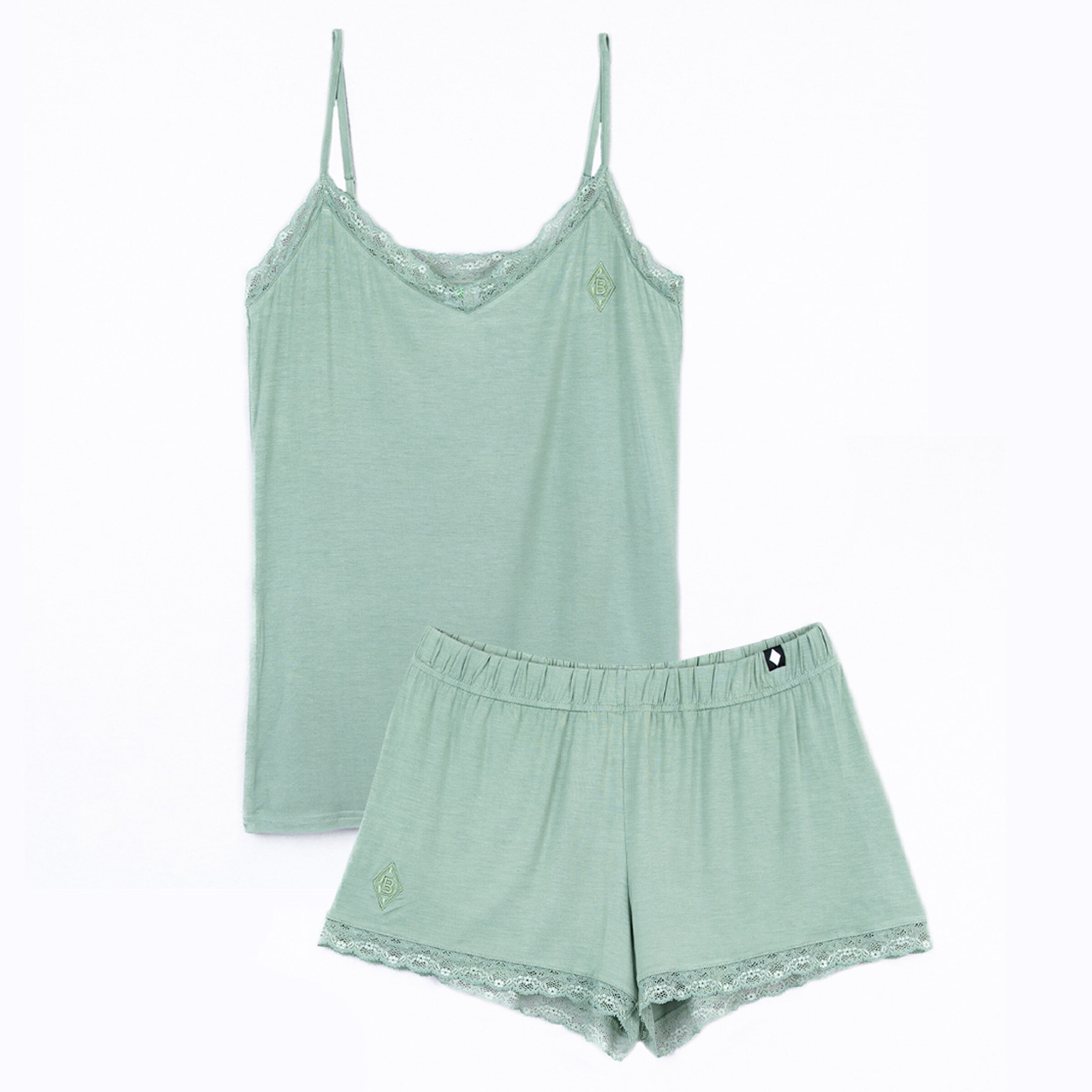 Green pajama set including a spaghetti-strap top and shorts.