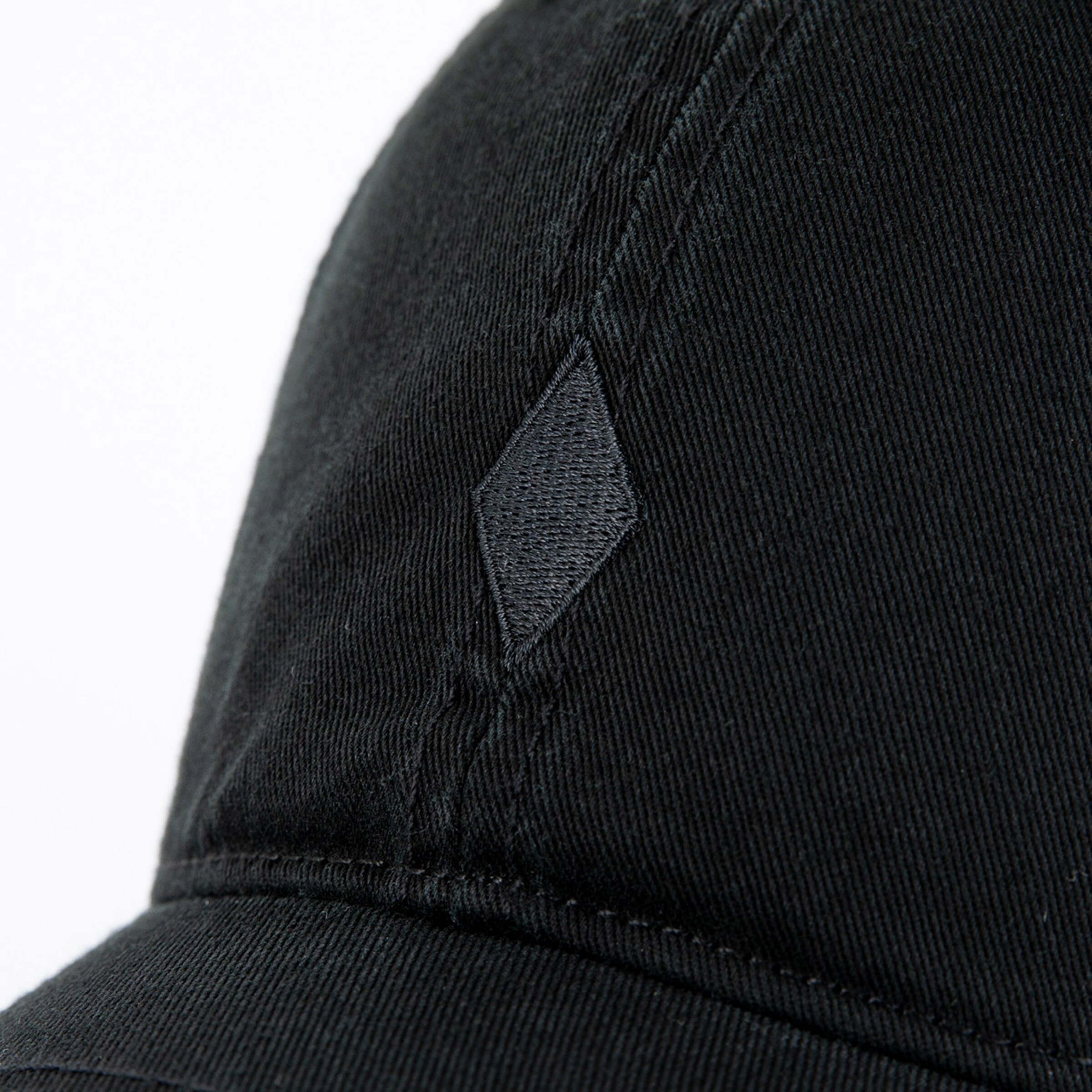 Black baseball cap with a diamond-shaped logo on the side.