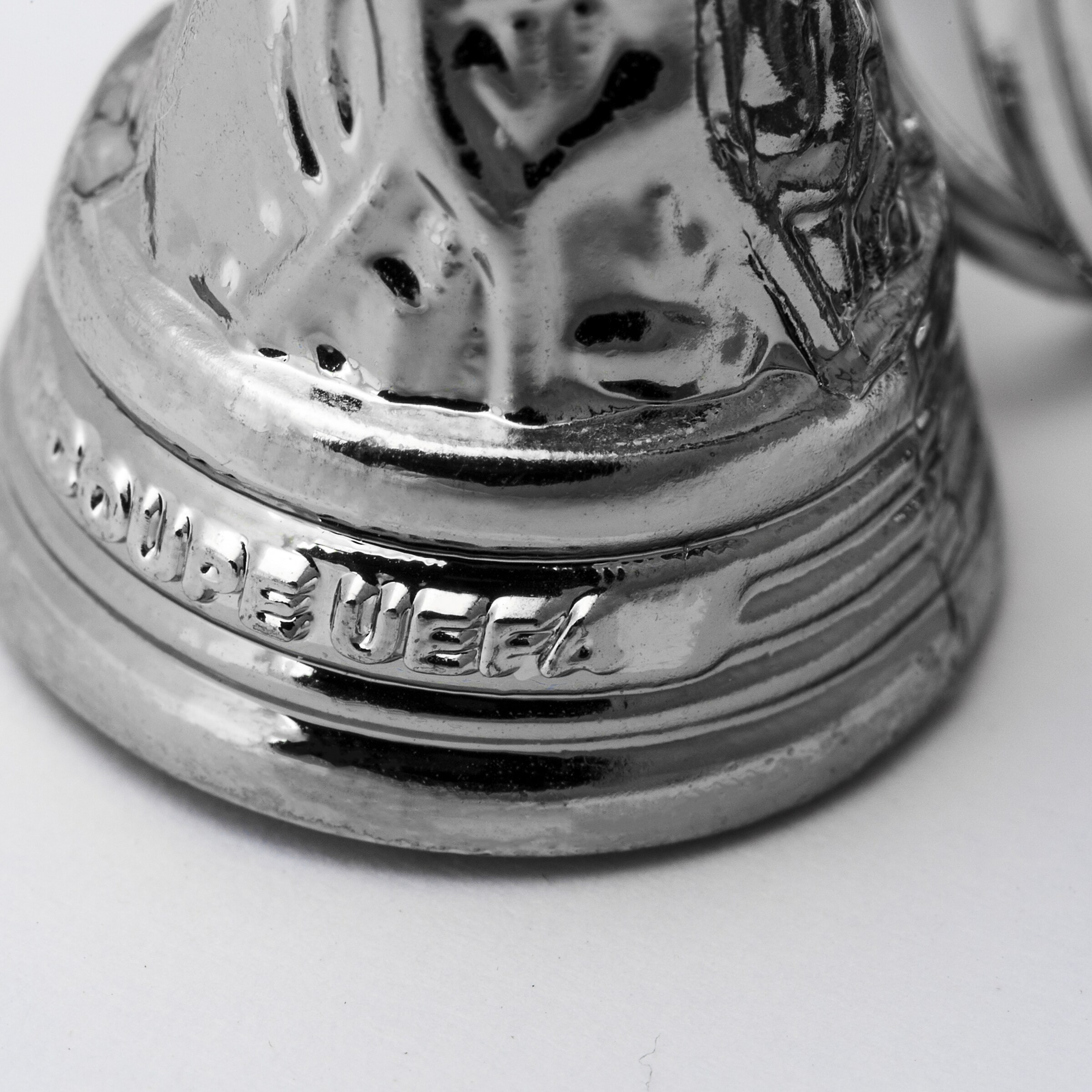 Stainless steel UEFA trophy with engraved inscription.