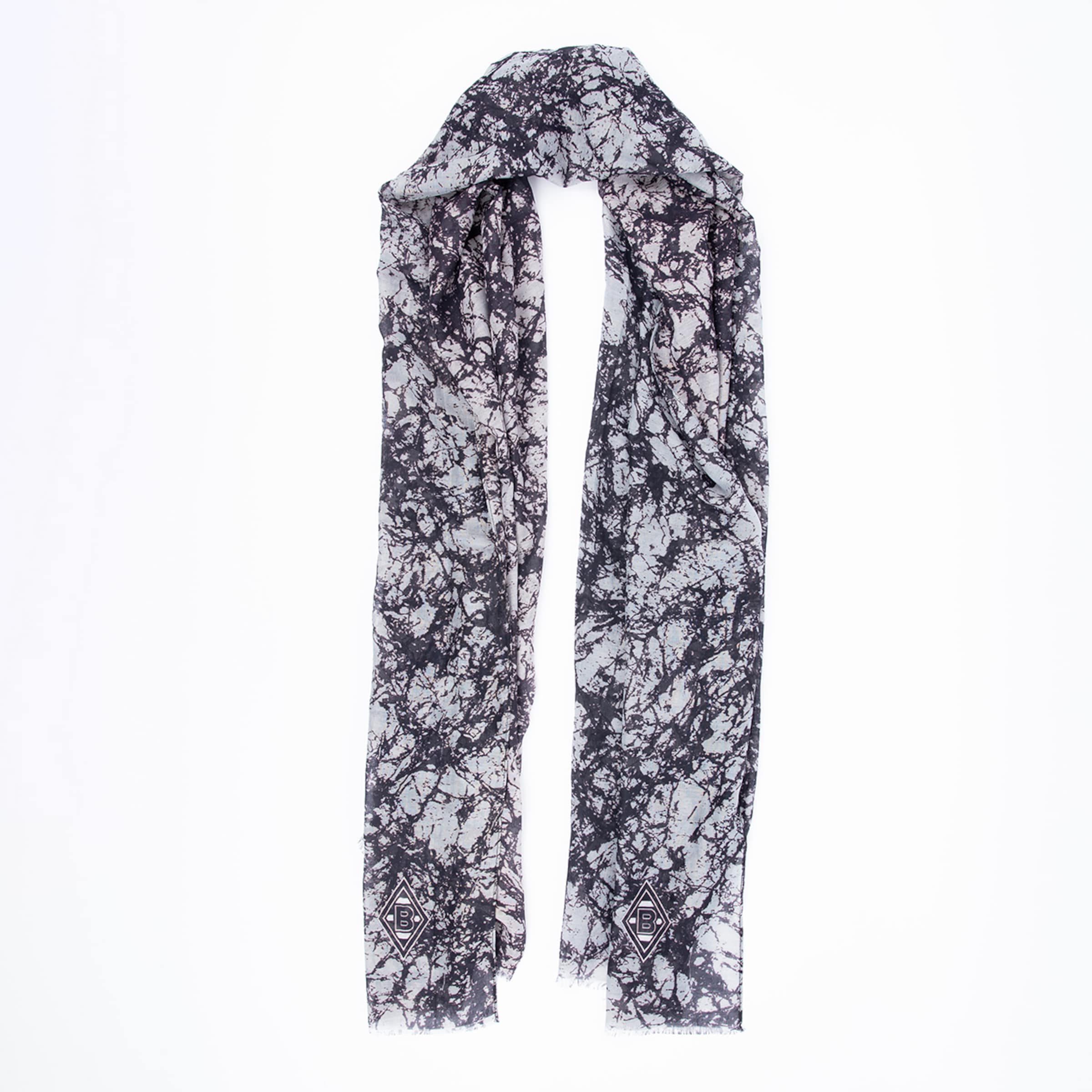 Schal mit einem abstrakten Muster in Schwarz und Weiß.