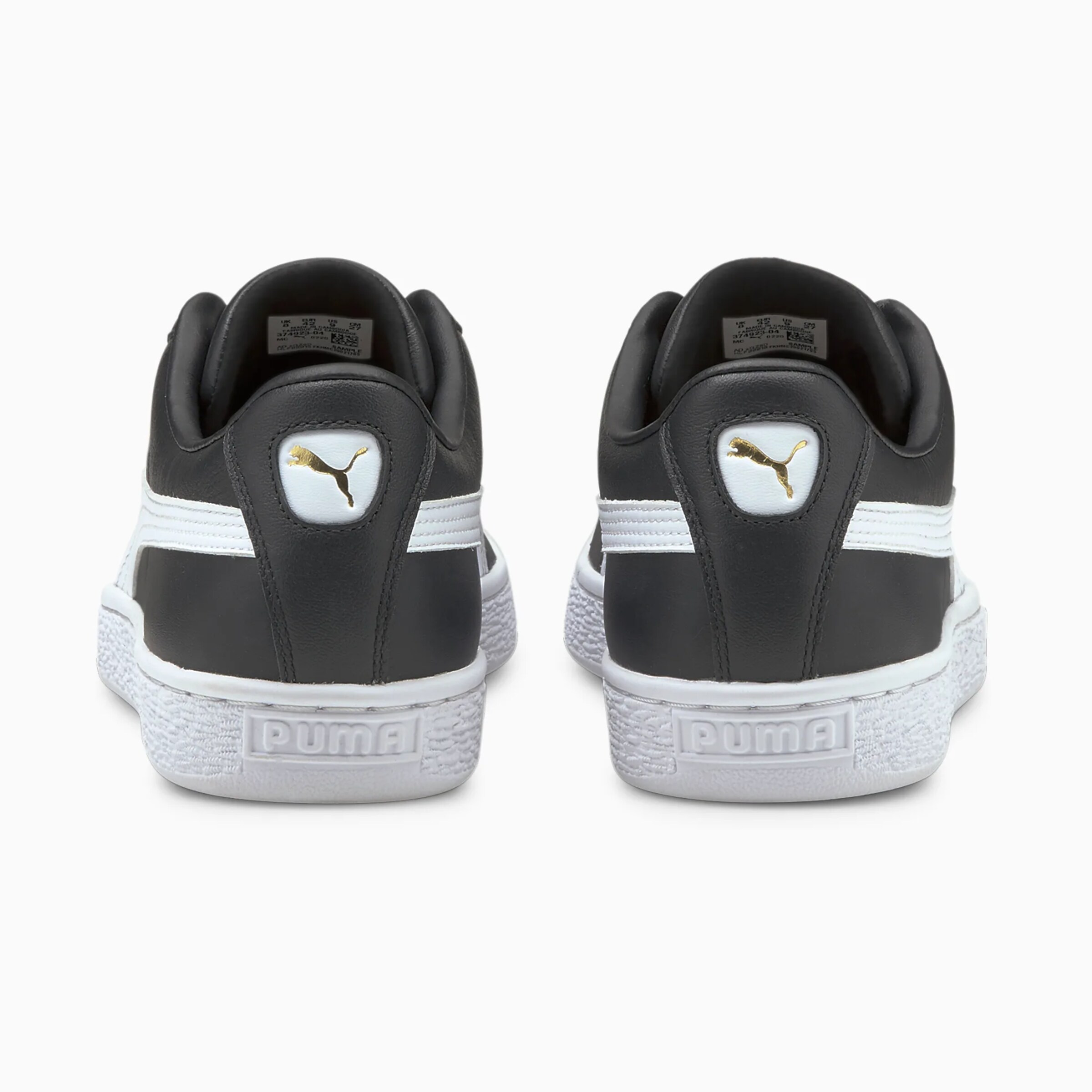 Schwarze Sportschuhe von Puma mit weißen Akzenten Rückansicht.