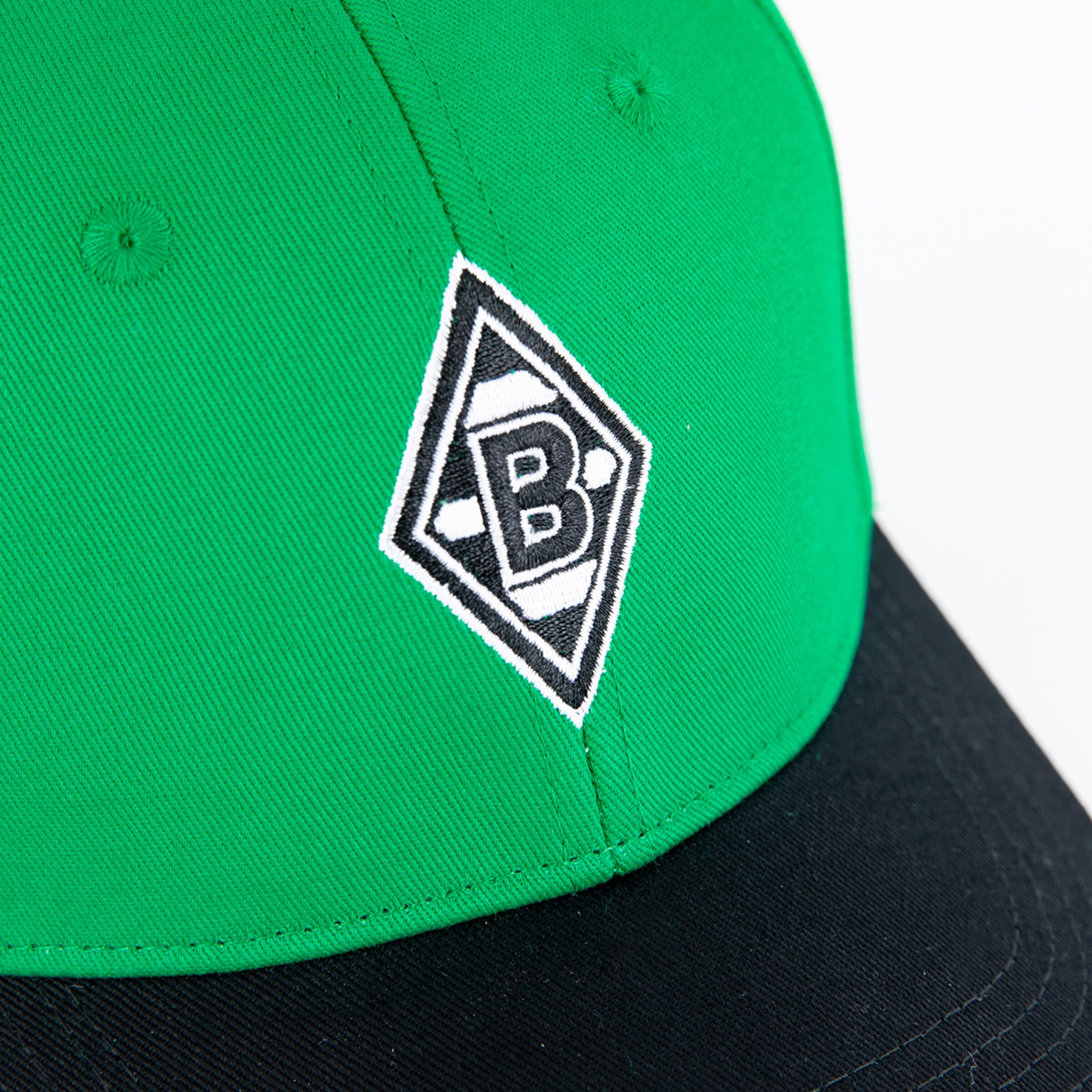 Grün-schwarze Baseballmütze mit dem Logo von Borussia Mönchengladbach.