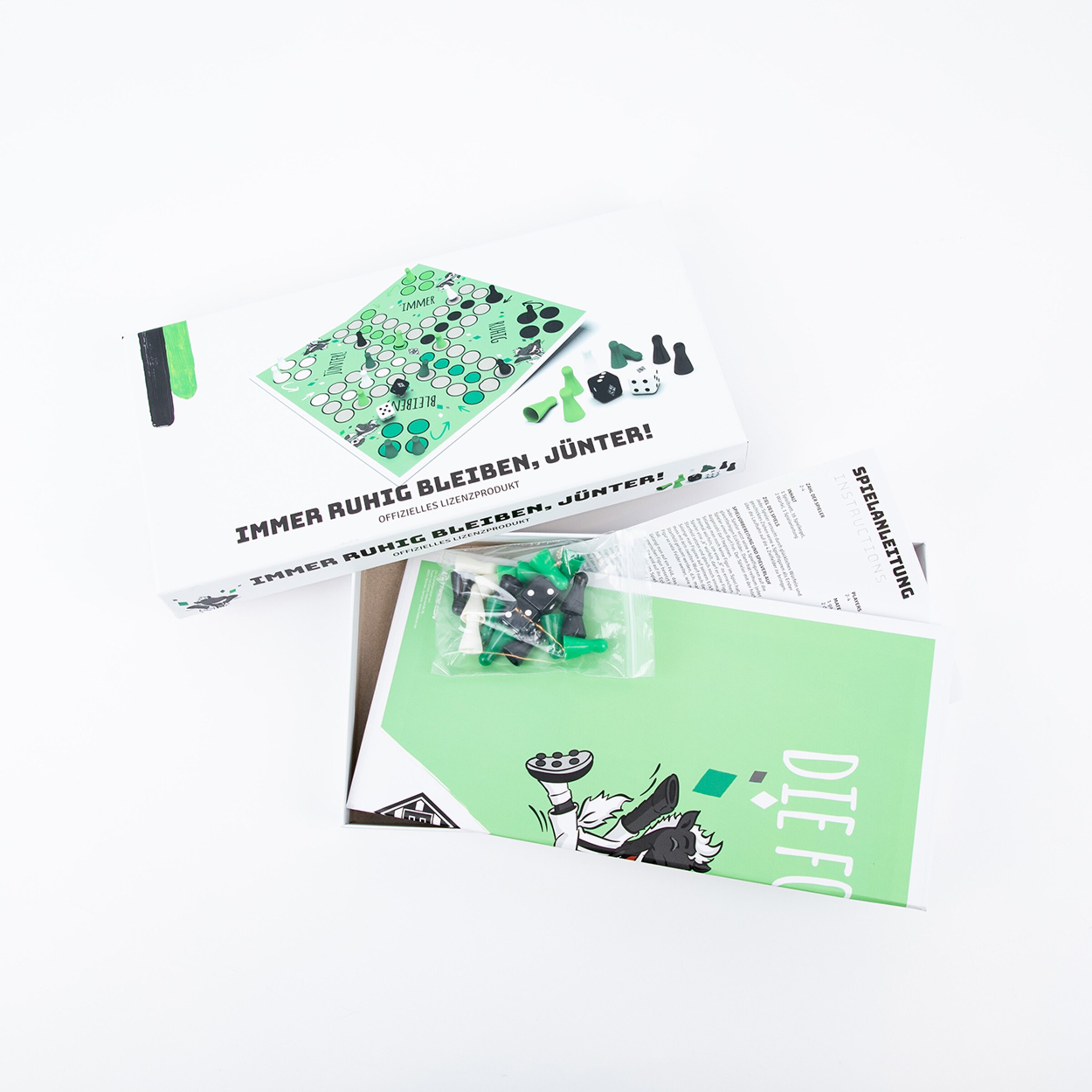 Das Spiel Immer ruhig bleiben Jünter! mit Spielbrett Figuren und Anweisungen.