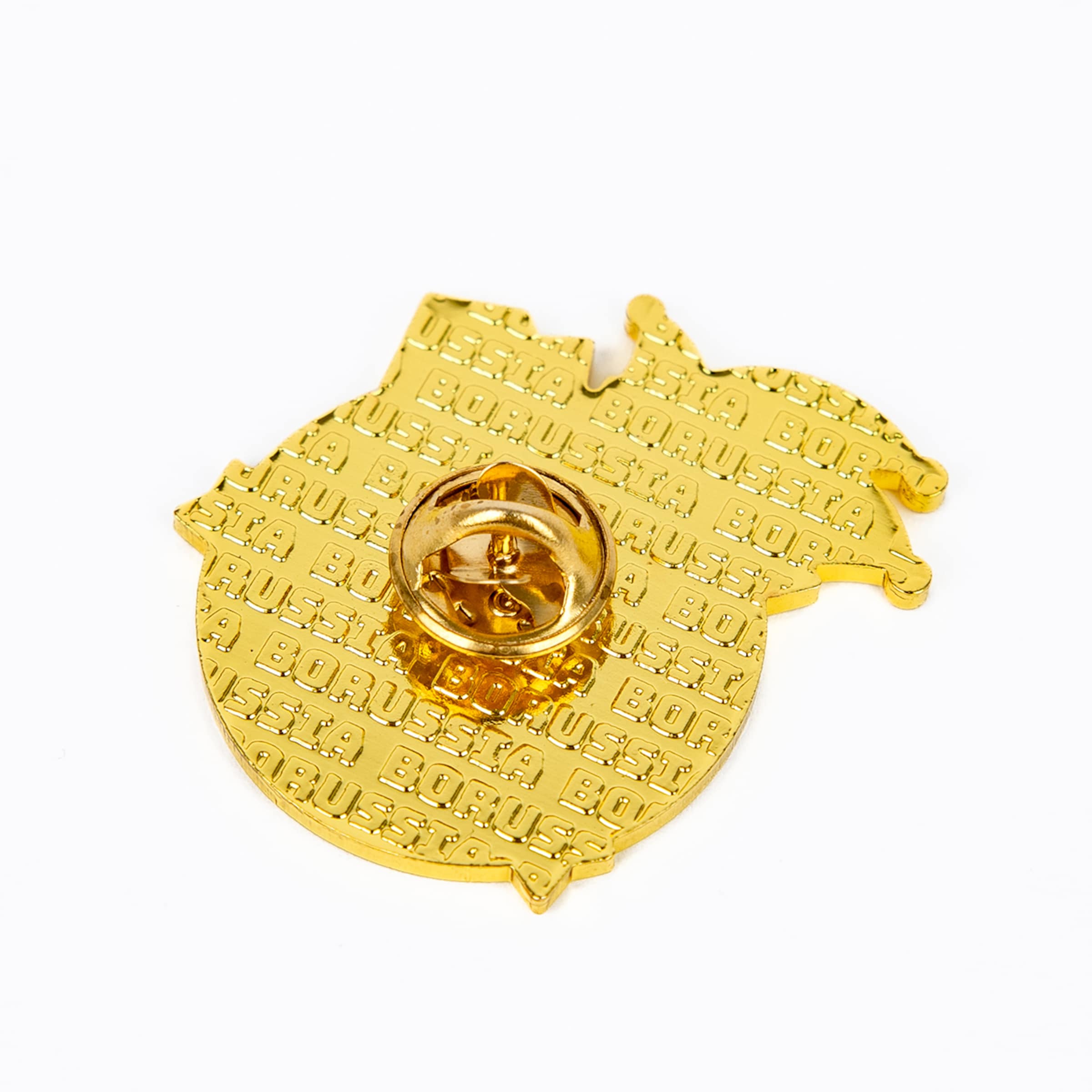 Rückseite eines goldfarbenen Pins mit eingeprägtem „BORUSSIA“-Schriftzug und Schmetterlingsverschluss auf weißem Hintergrund.