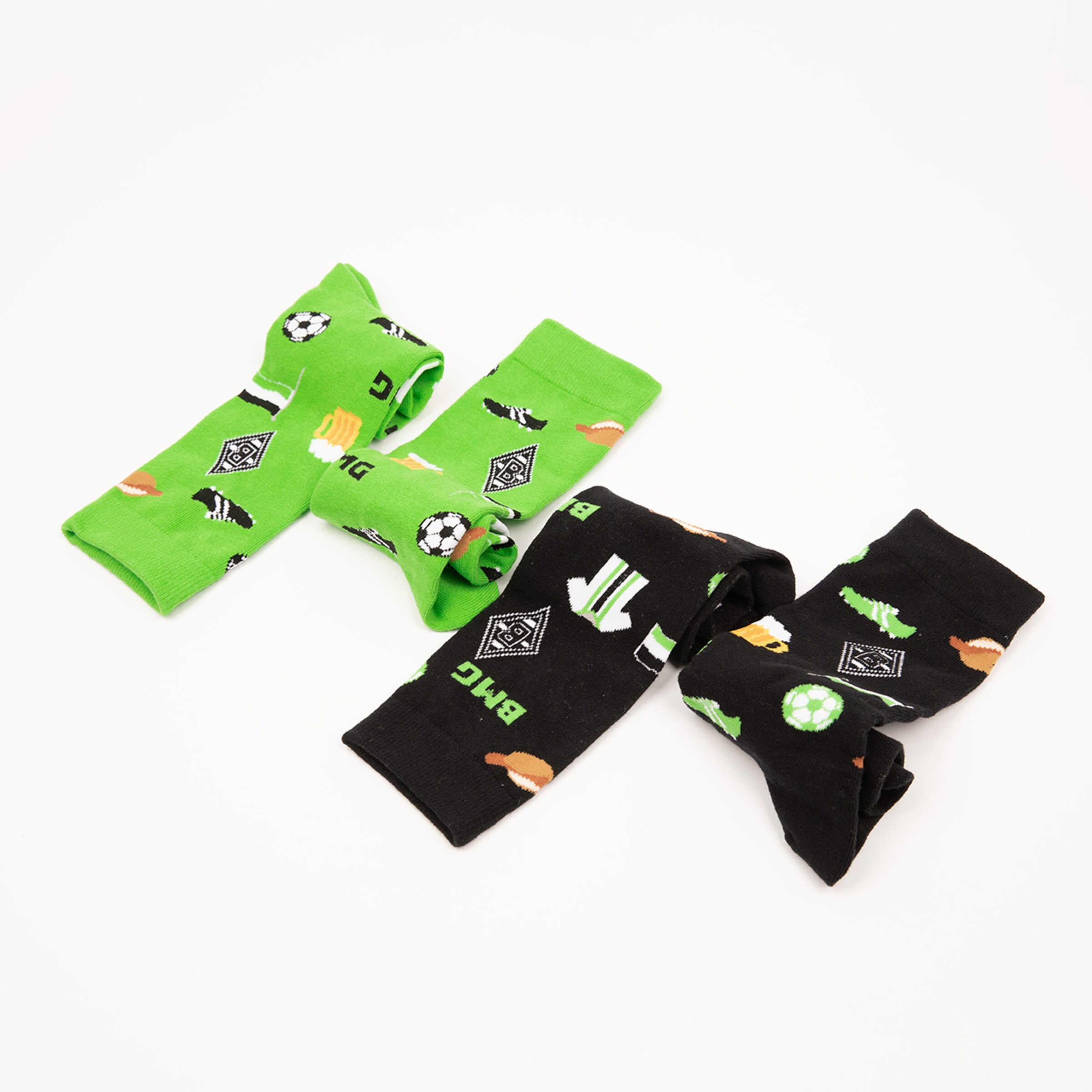Socks in green with soccer motifs and black with colorful symbols.