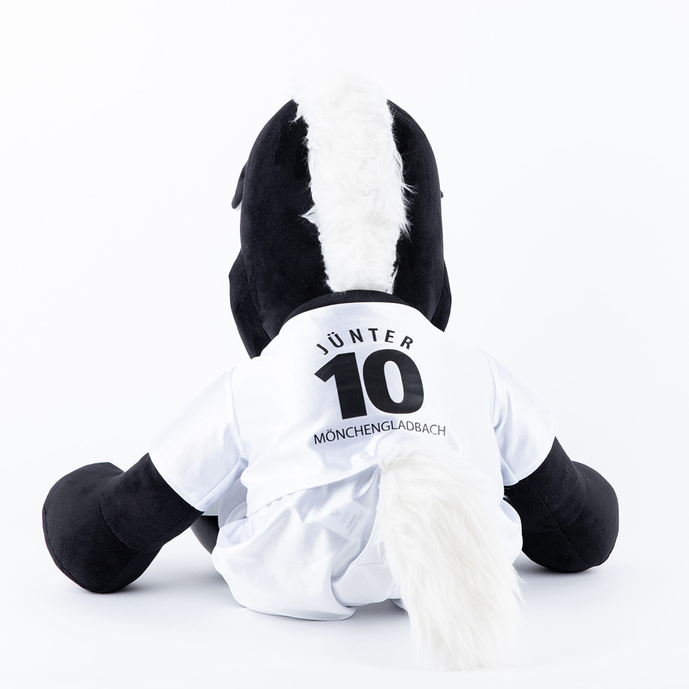 Plush figure Jünter wearing a white jersey with number 10.