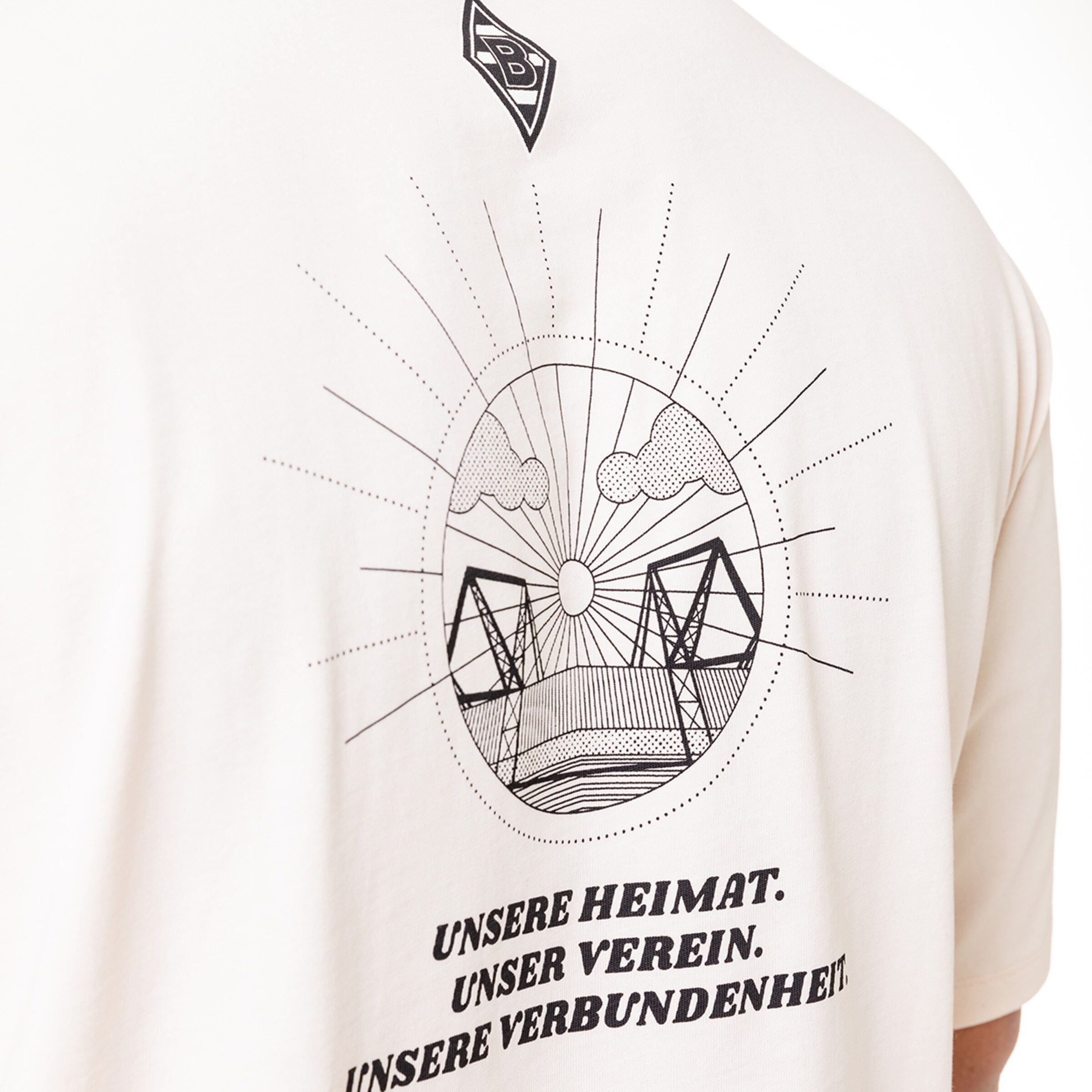Back view of a t-shirt featuring a graphic of a stadium and the text OUR HOME. OUR CLUB. OUR CONNECTION.