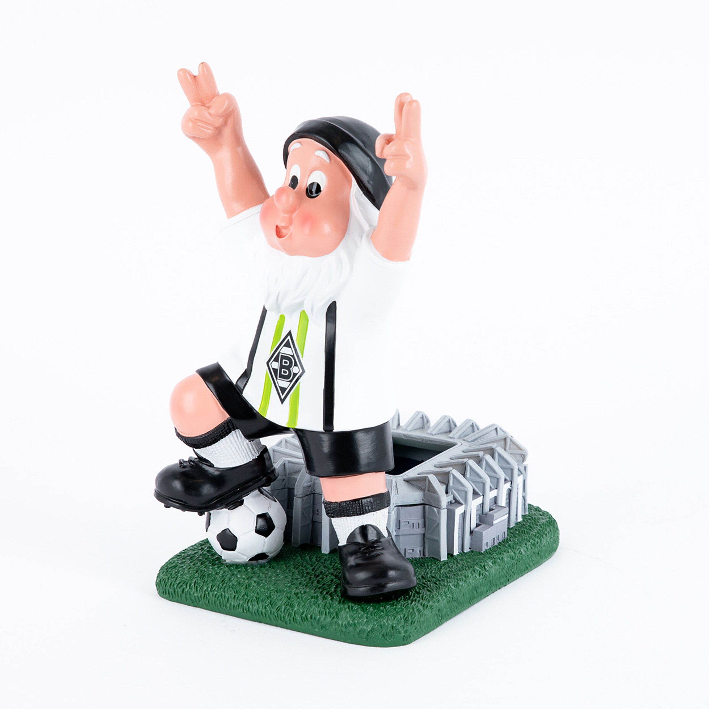 Eine Figur eines Fußballspielers in einem Borussia Mönchengladbach-Trikot die auf einem Fußball steht.