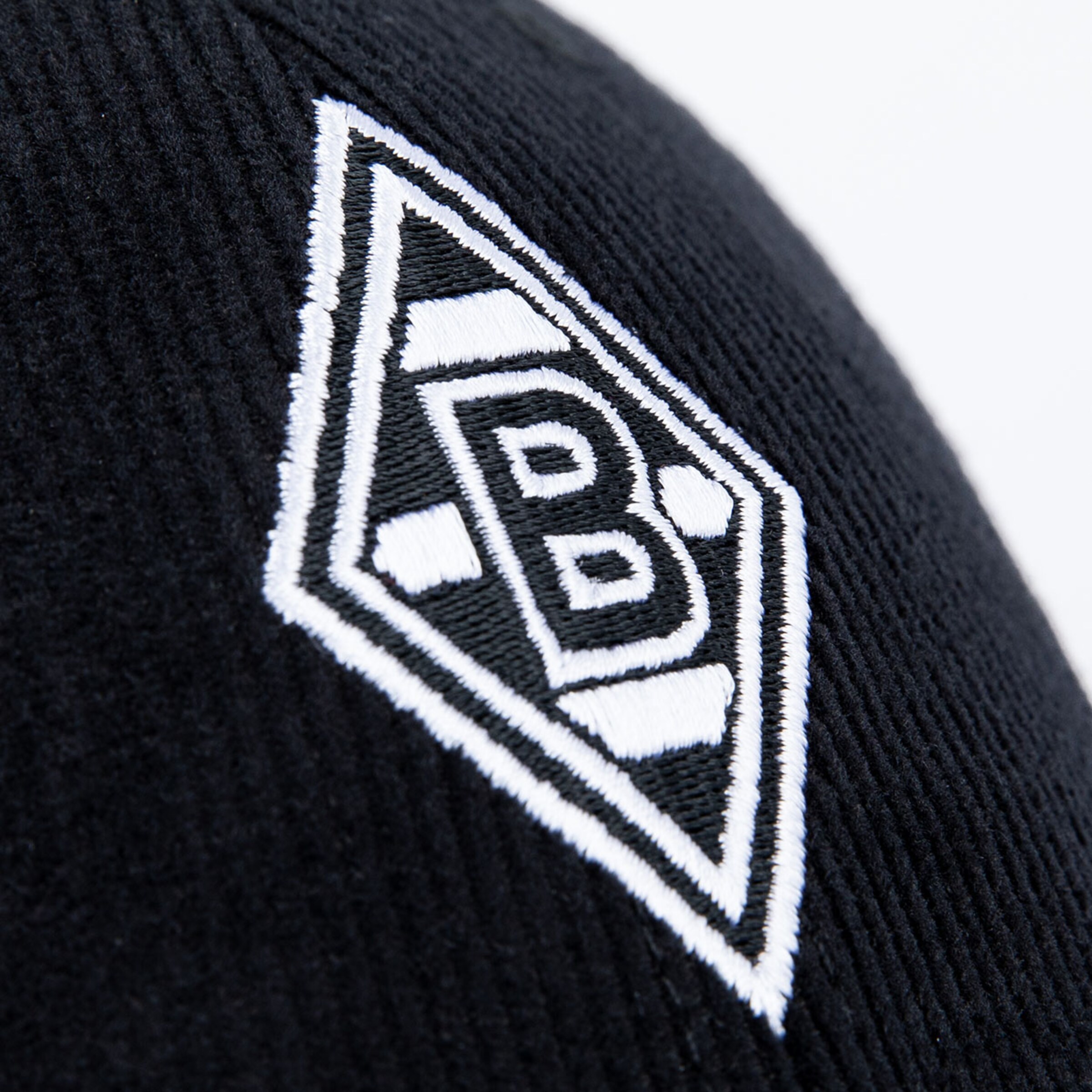 Logo design of Borussia Mönchengladbach on a black beanie.