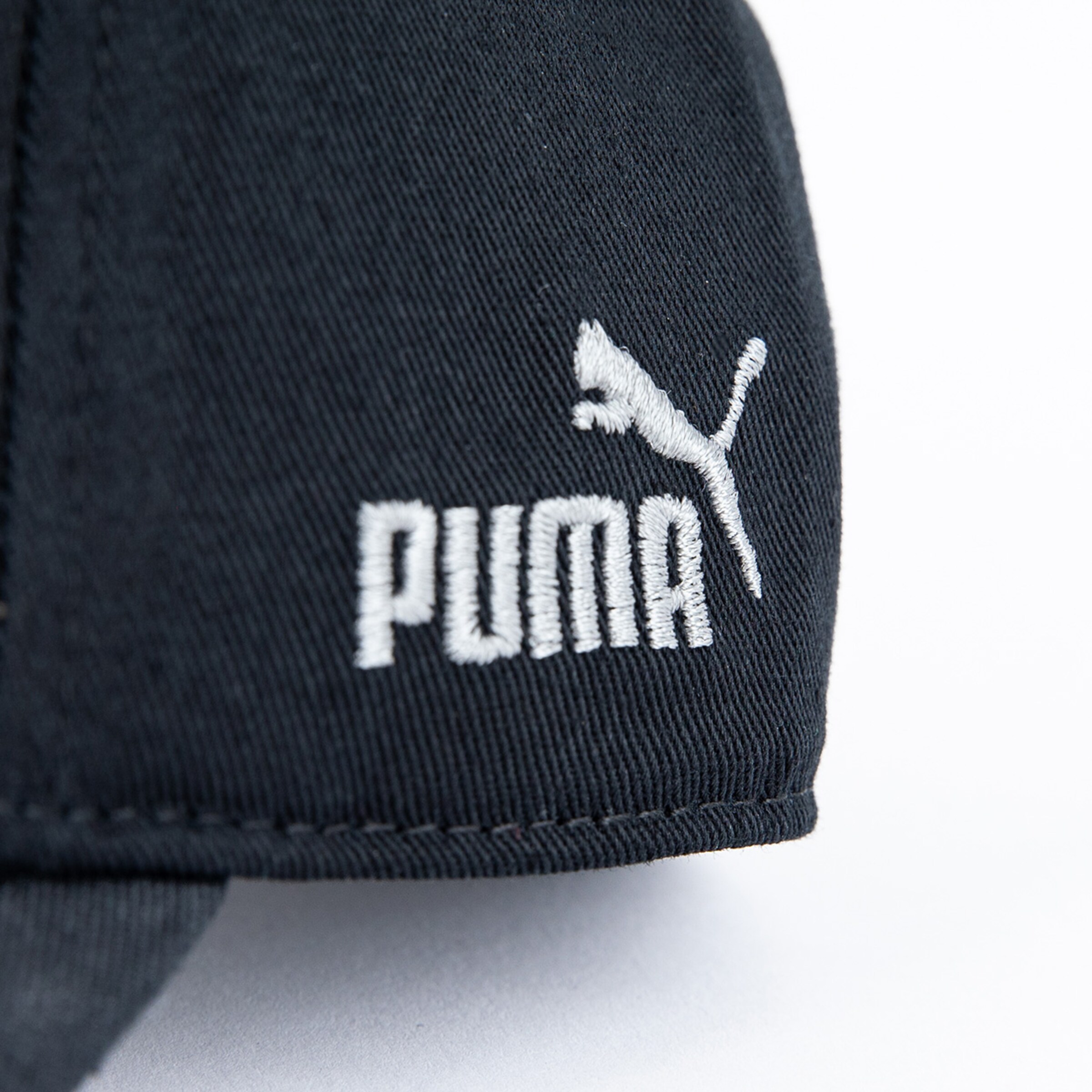 Black Puma cap with white logo.