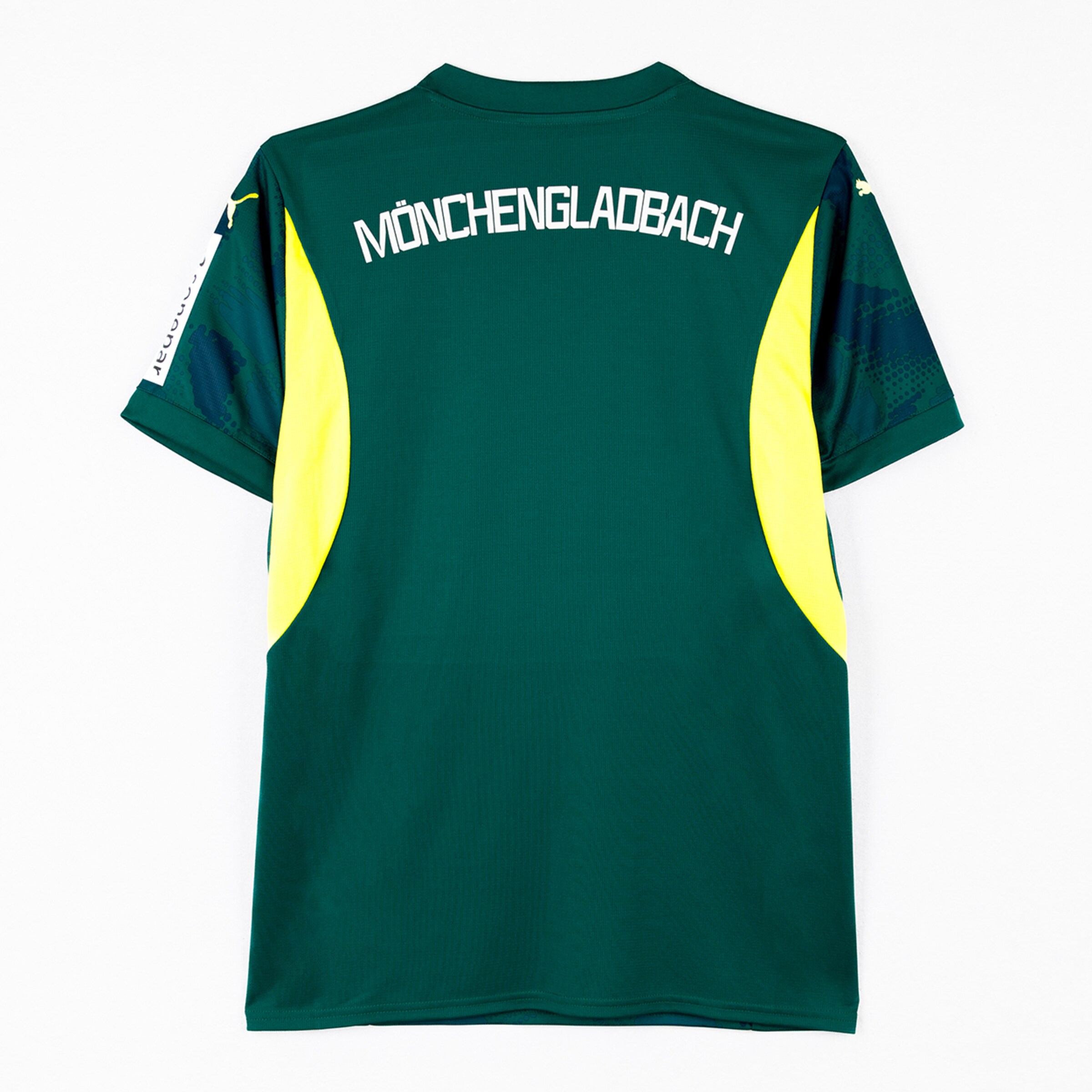 Rückseite eines dunkelgrünen Fußballtrikots mit gelben Akzenten und weißem „MÖNCHENGLADBACH“-Schriftzug auf dem Rücken.