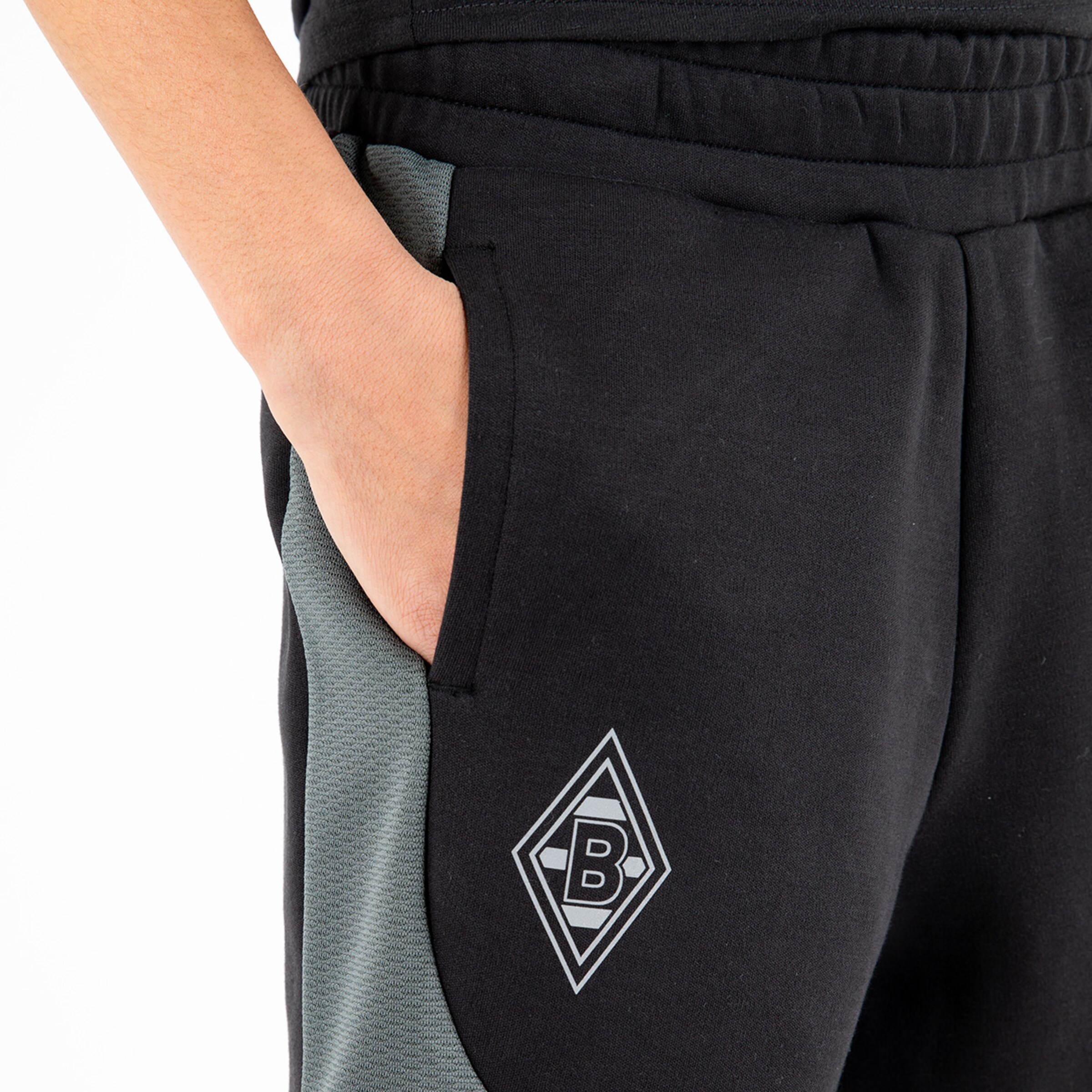 Black joggers with gray inserts and Borussia Mönchengladbach logo on the thigh.
