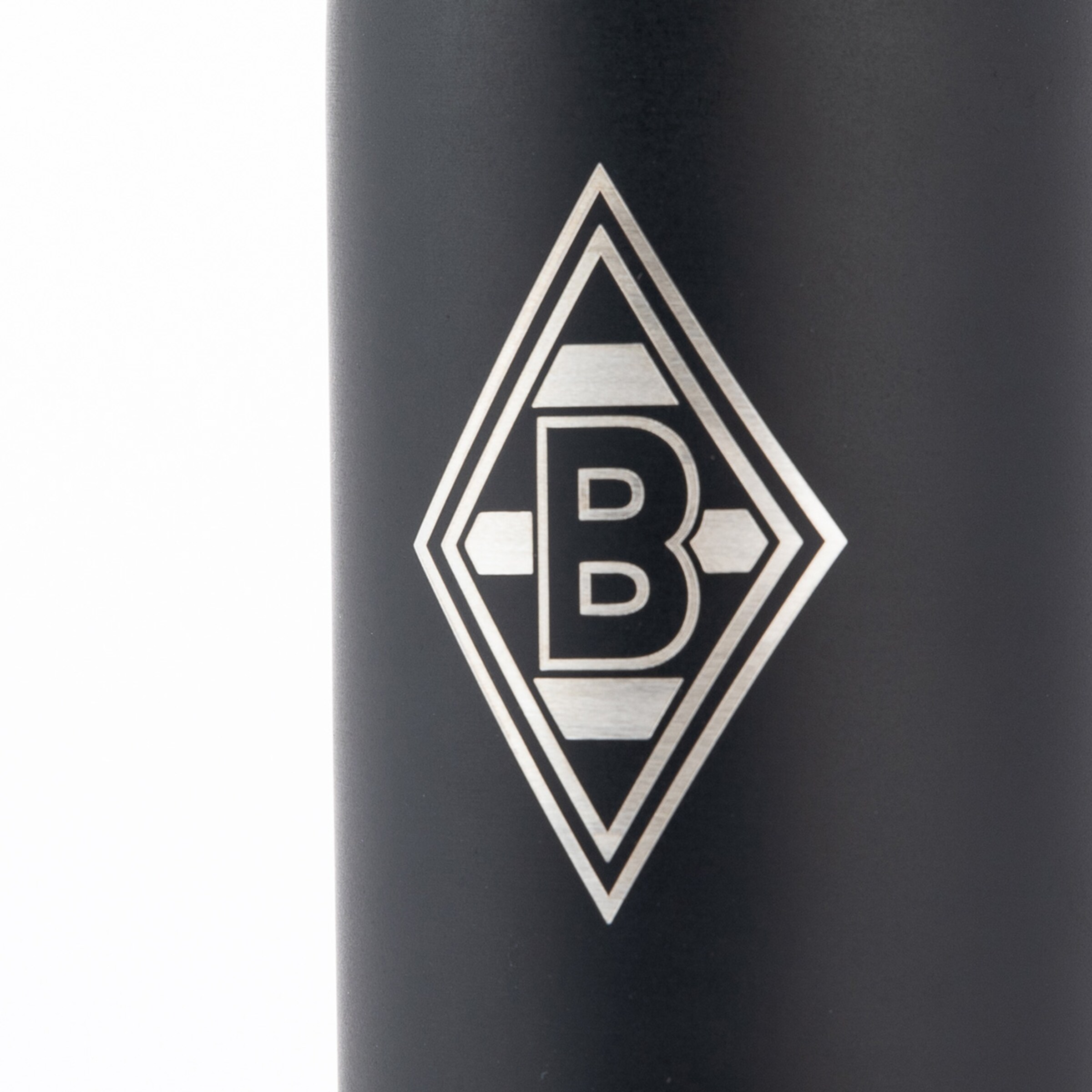 Silver Borussia Mönchengladbach logo (diamond with letter B) engraved on a matte black surface.
