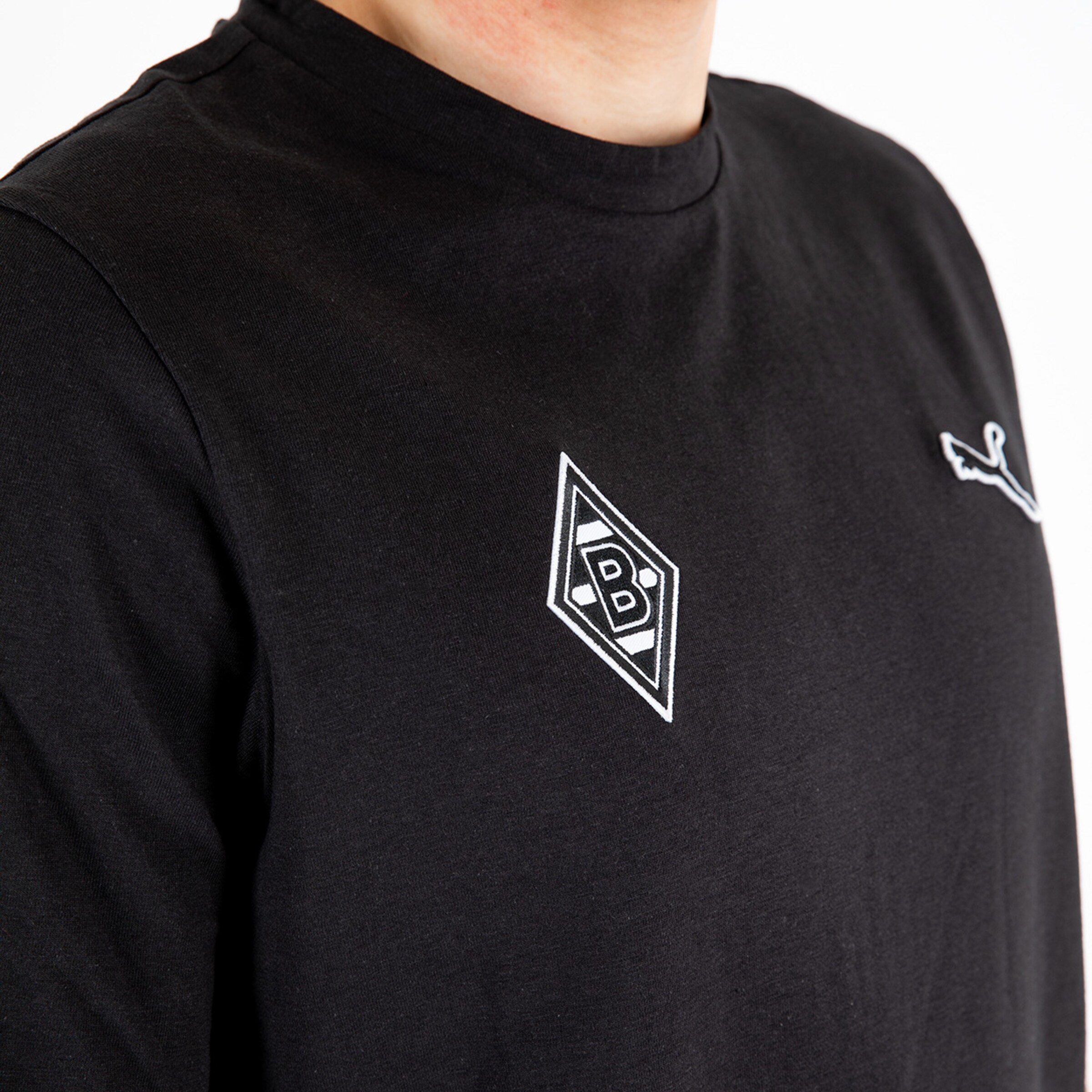 Black T-shirt featuring Borussia Mönchengladbach logo on the left chest.