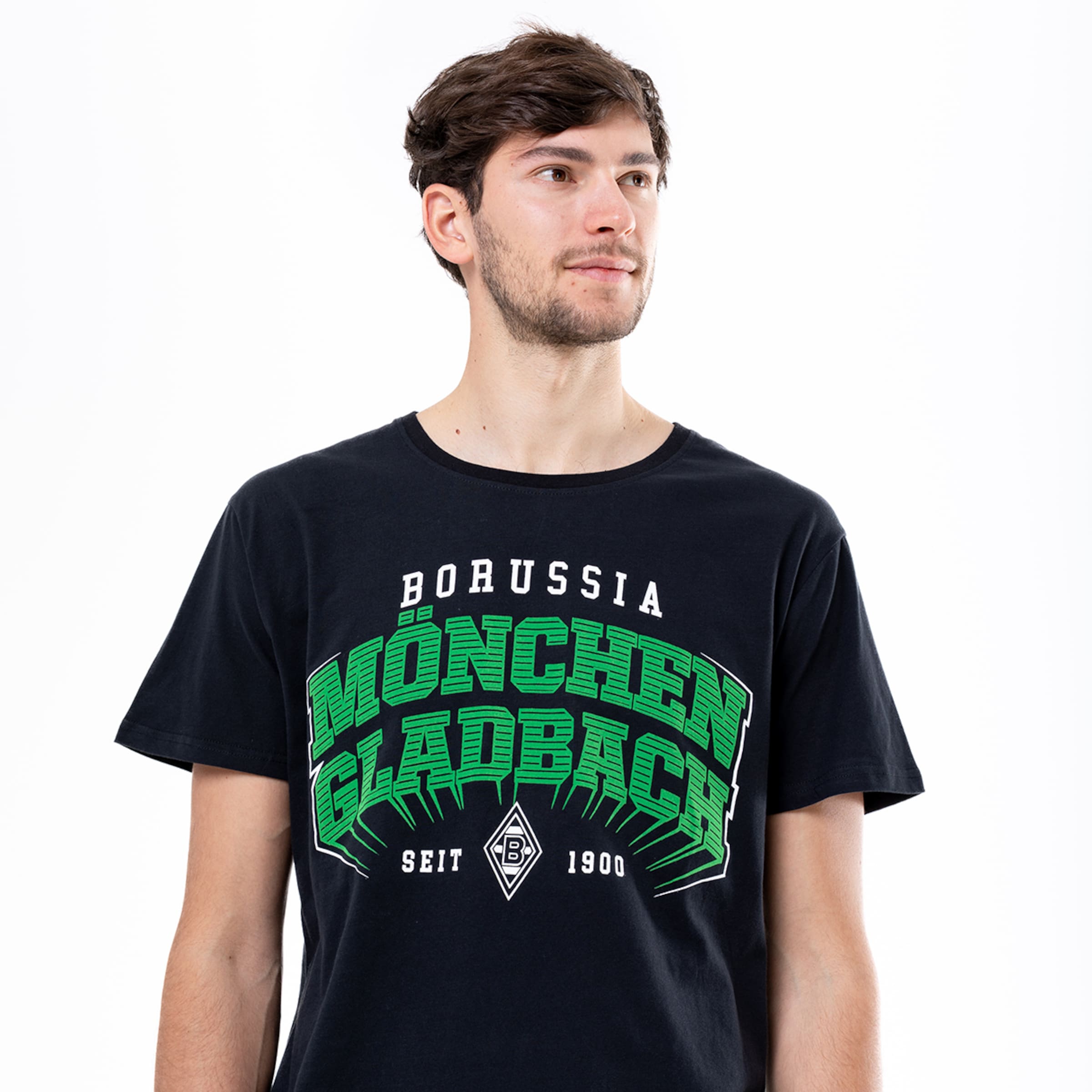 Man wearing a black T-shirt with Borussia Mönchengladbach since 1900 printed on it.