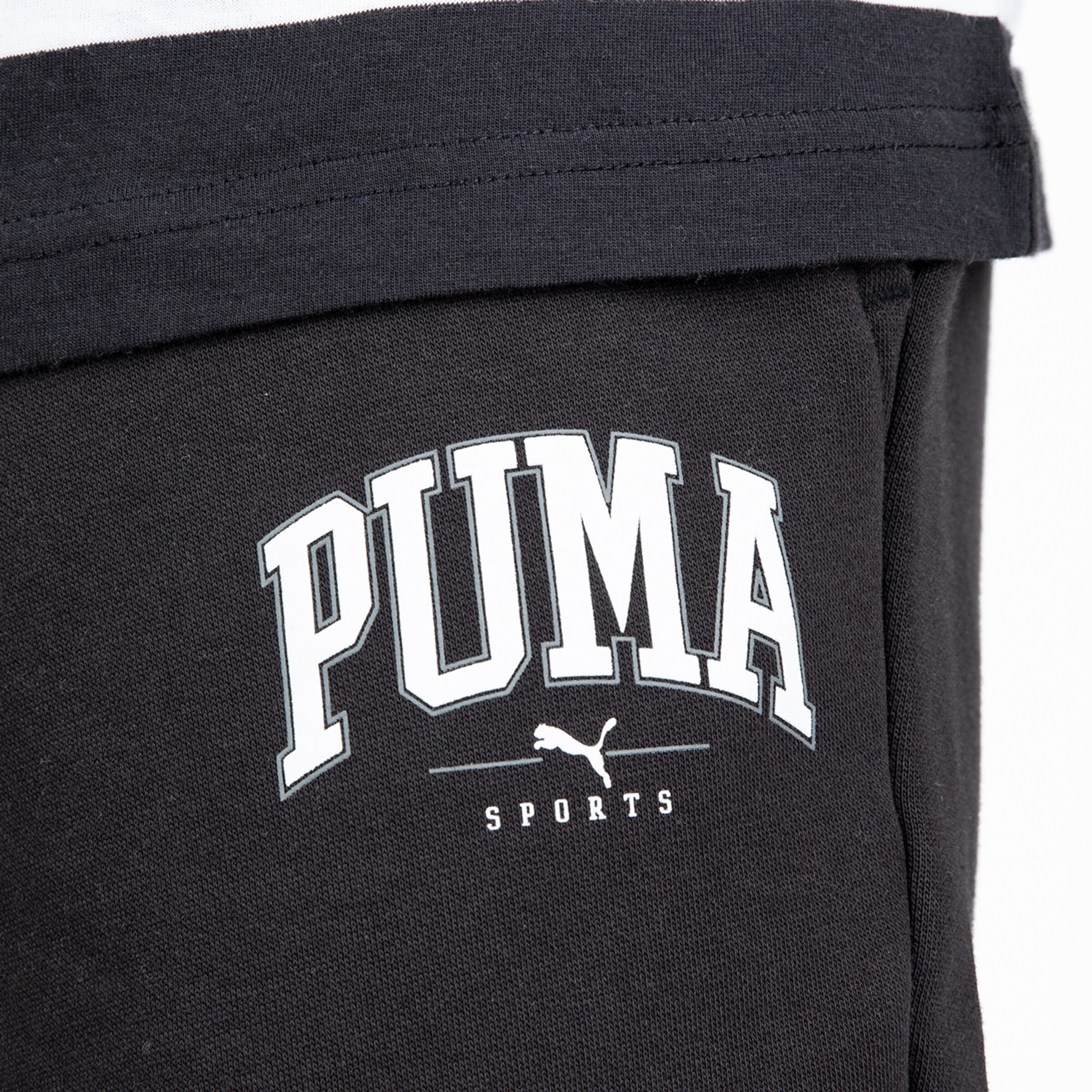 Black sports shorts featuring PUMA logo and text.