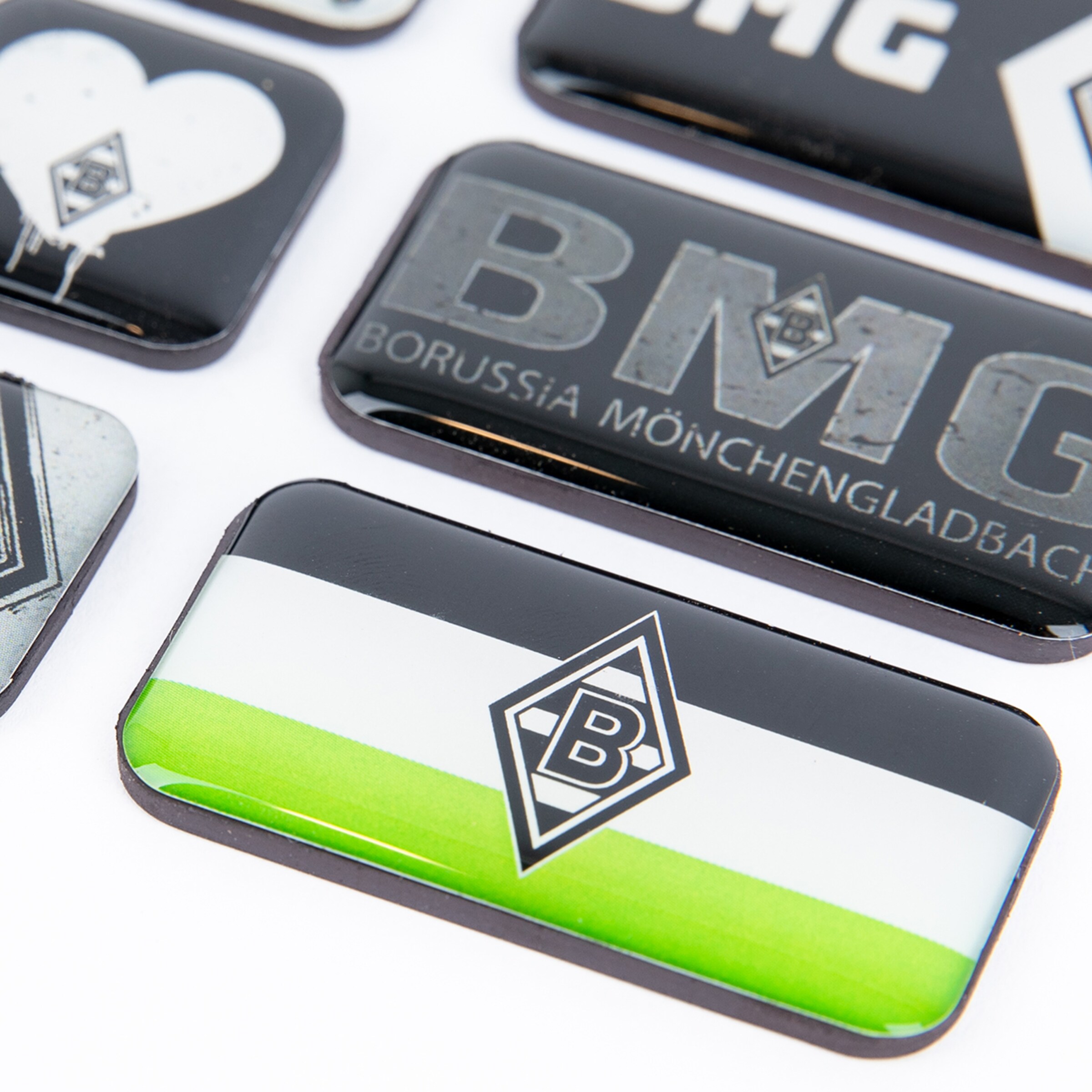 Various fridge magnets featuring the Borussia Mönchengladbach logo.