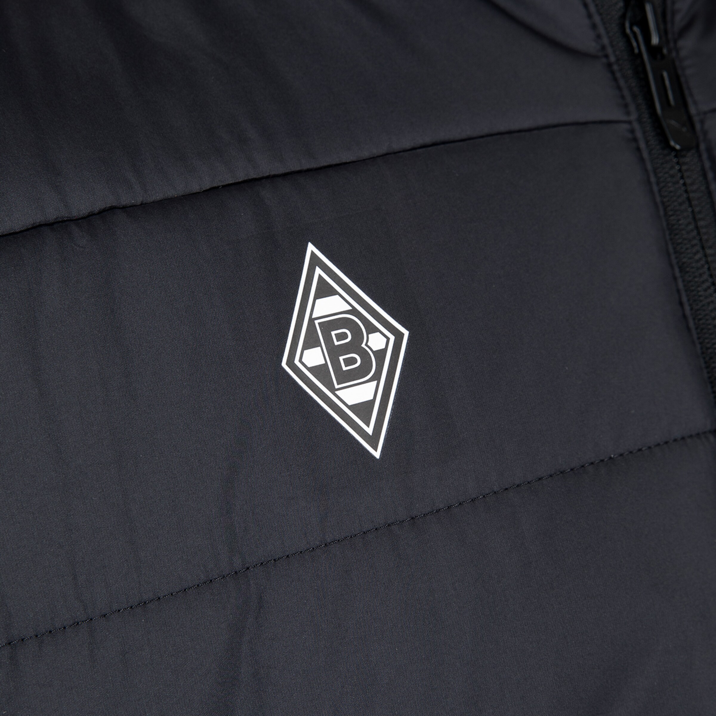 Logo of Borussia Mönchengladbach on a black jacket.