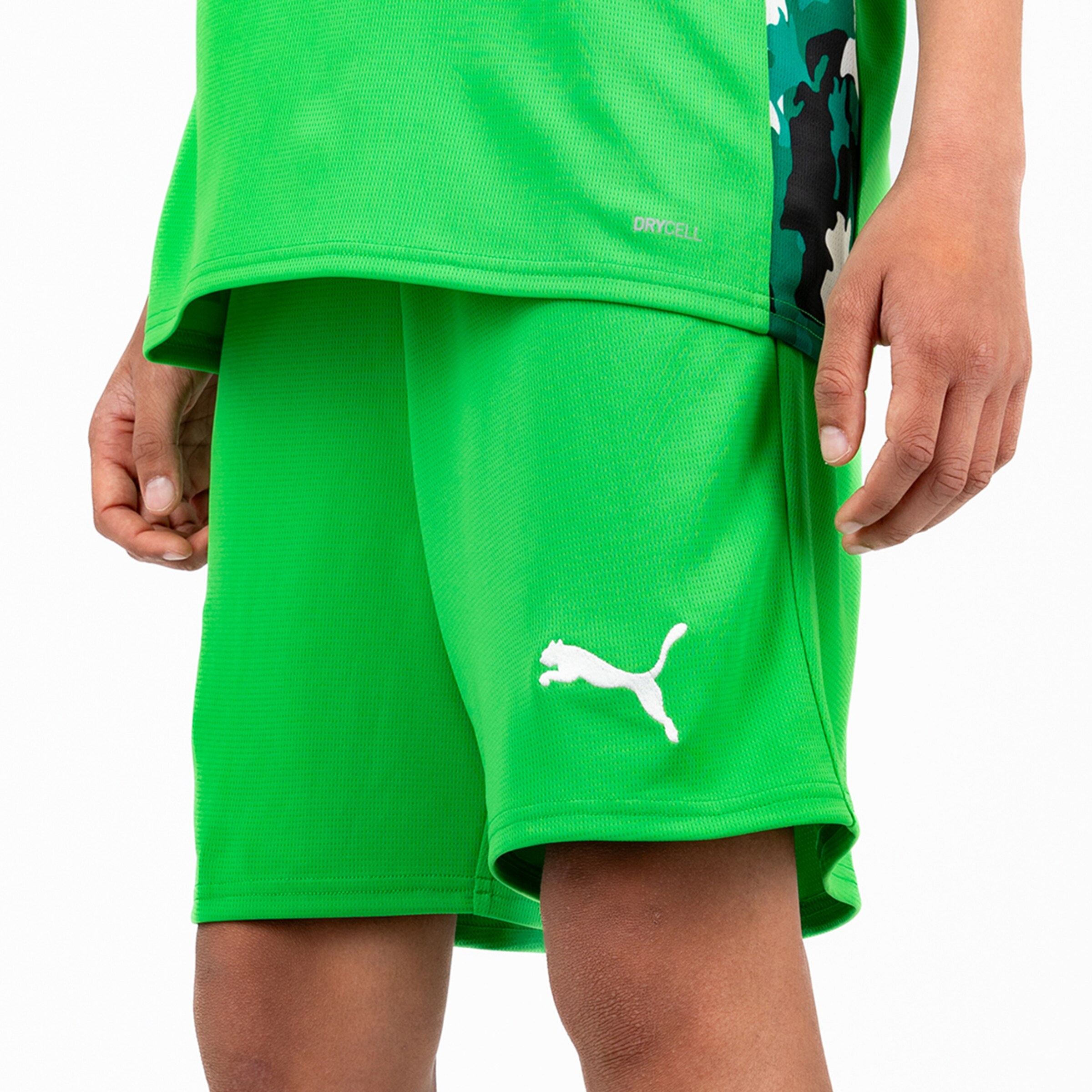 Green sports shorts featuring Puma logo and DRYCELL technology.
