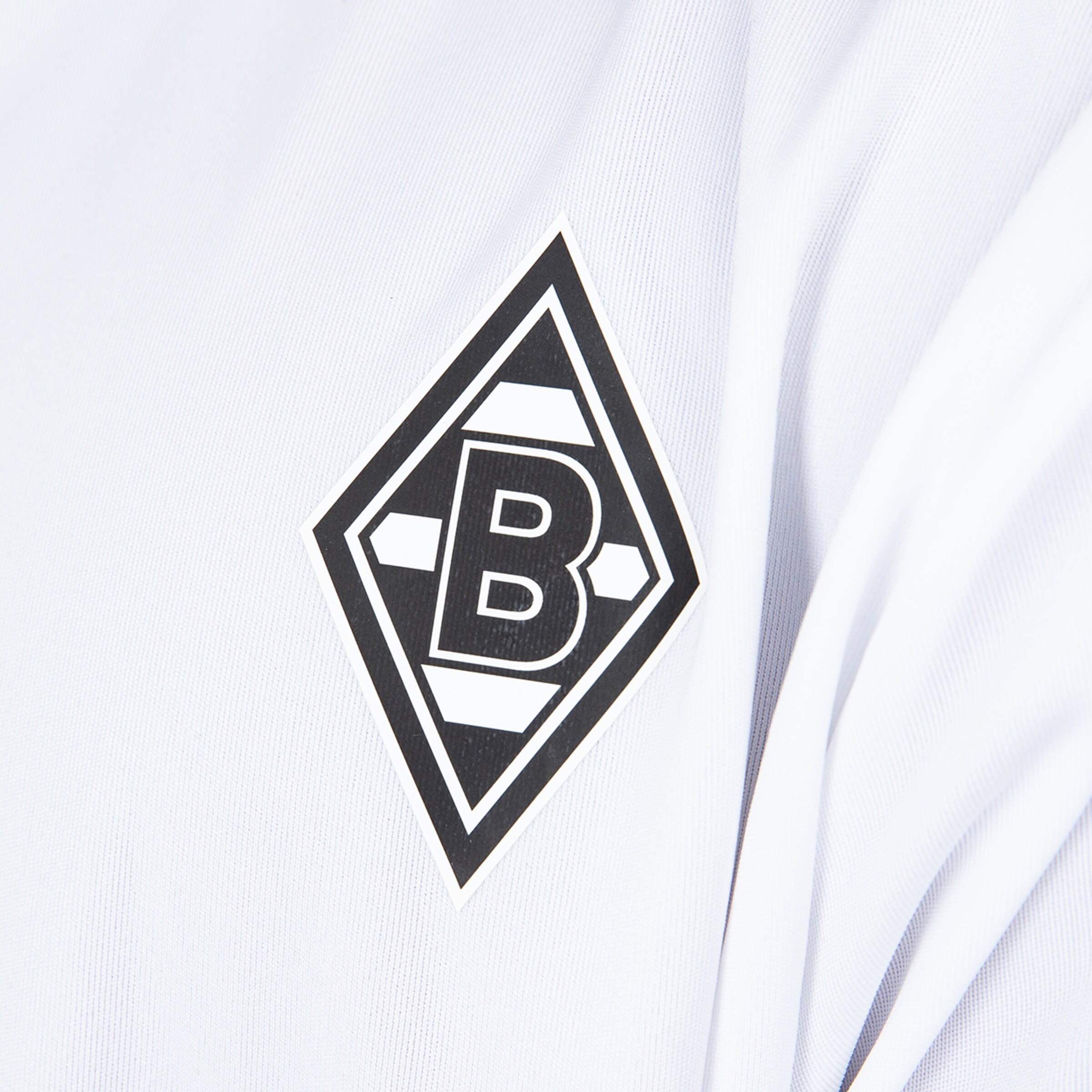Logo of Borussia Mönchengladbach on a white jersey.