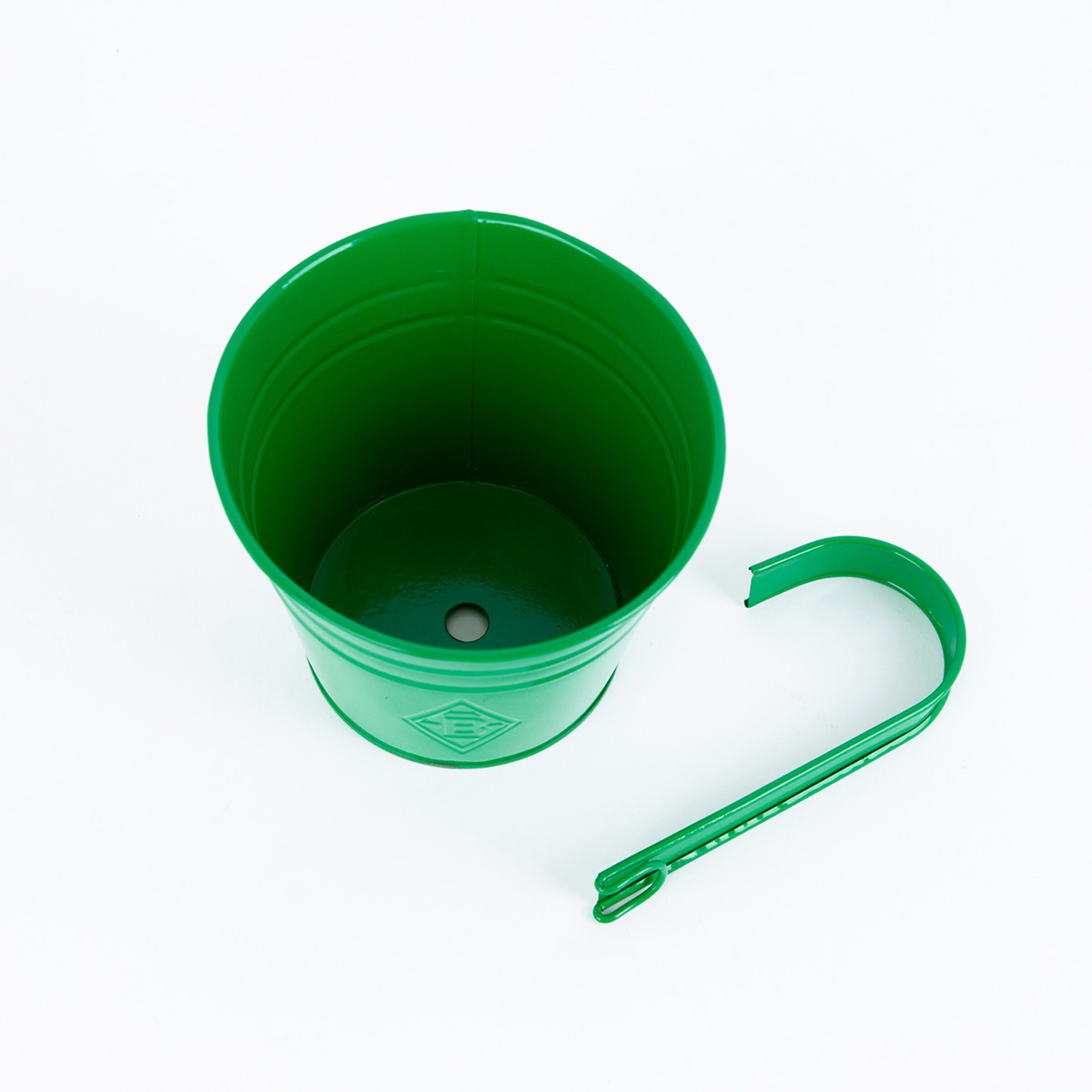 Green plastic cup with a hook and a hole at the bottom.